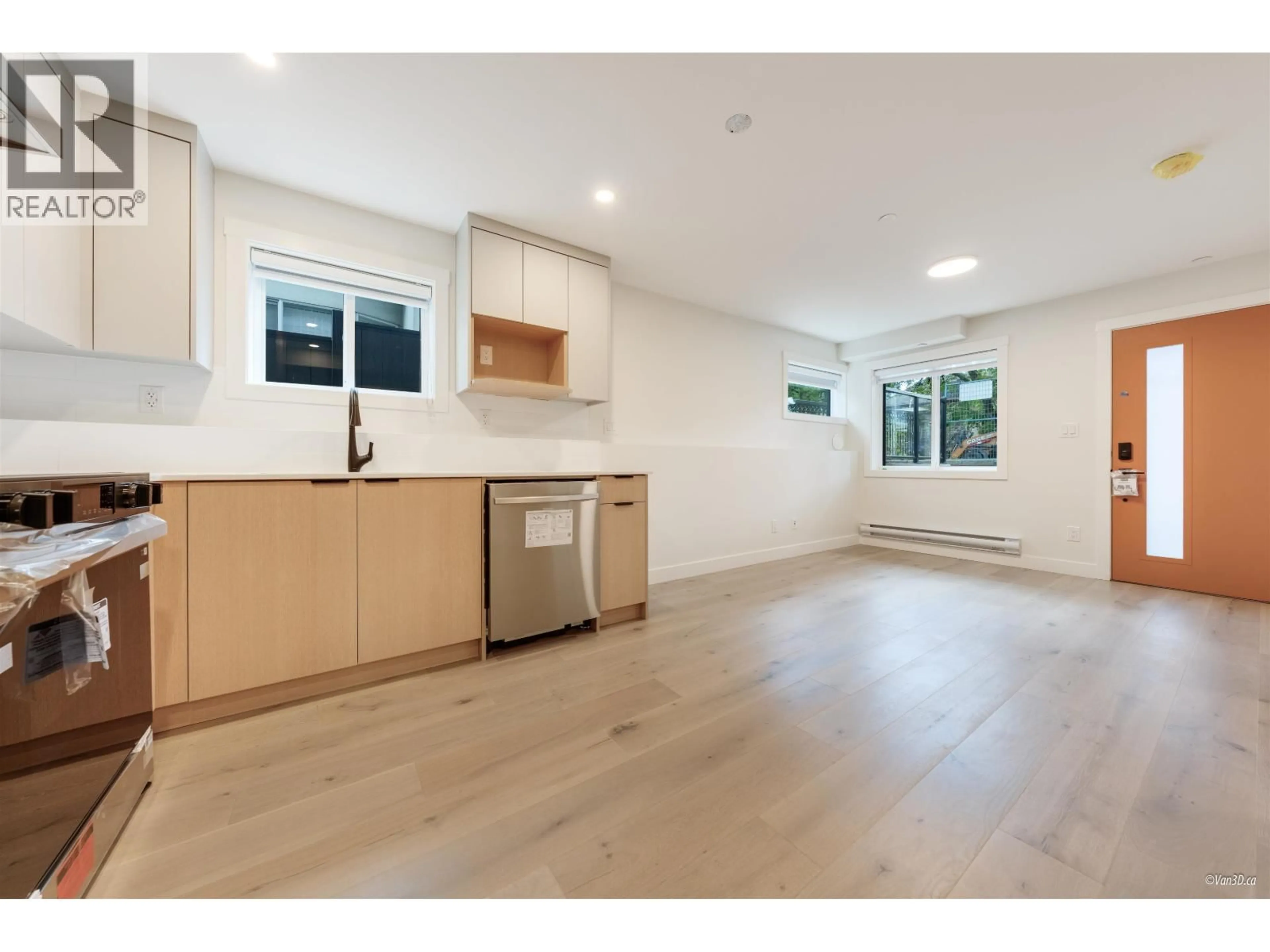 Open concept kitchen, wood/laminate floor for 101 - 5092 SLOCAN STREET, Vancouver British Columbia V5R2A5