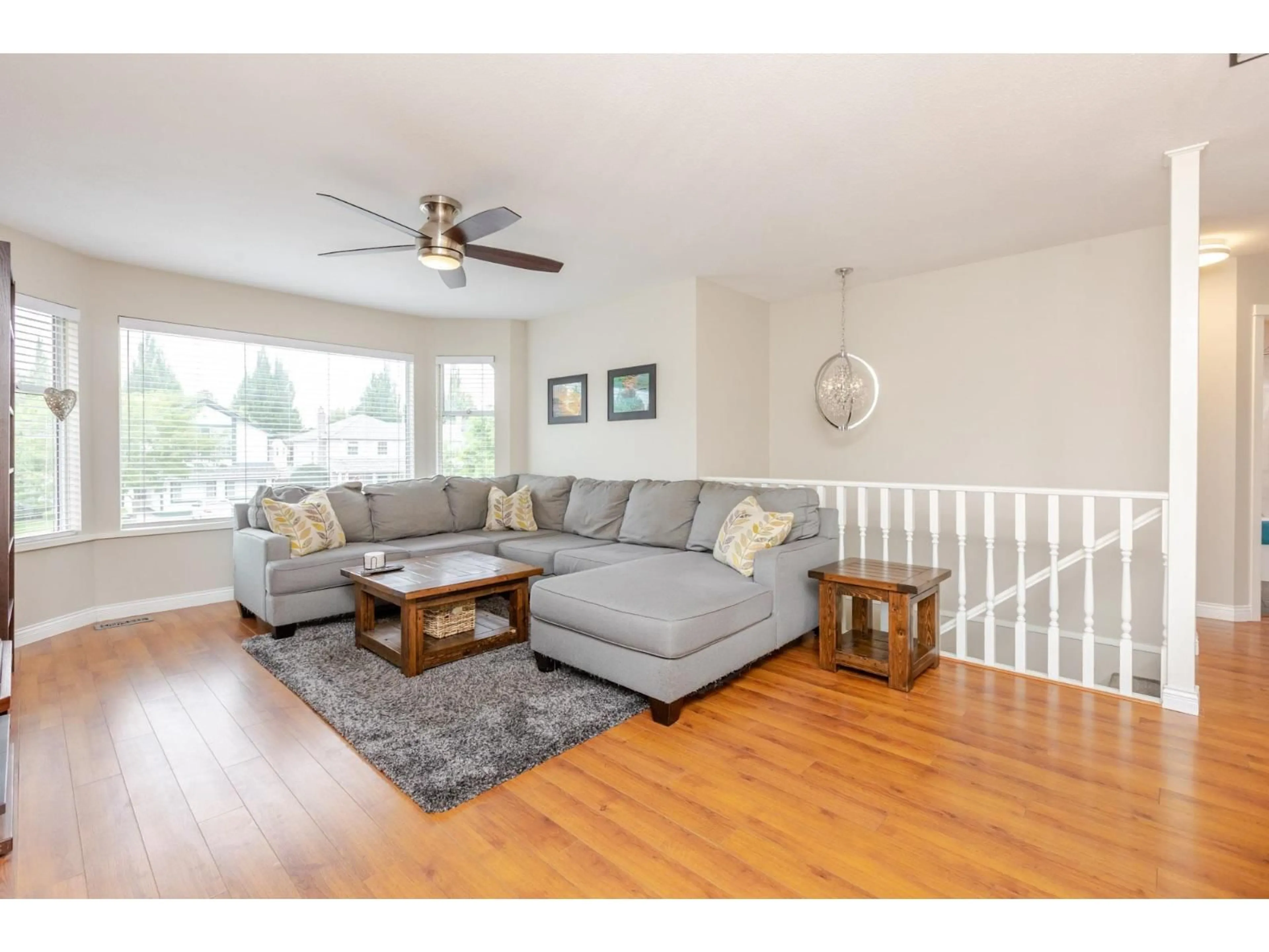 Living room with furniture, wood/laminate floor for 6324 172A, Surrey British Columbia V3S6V4