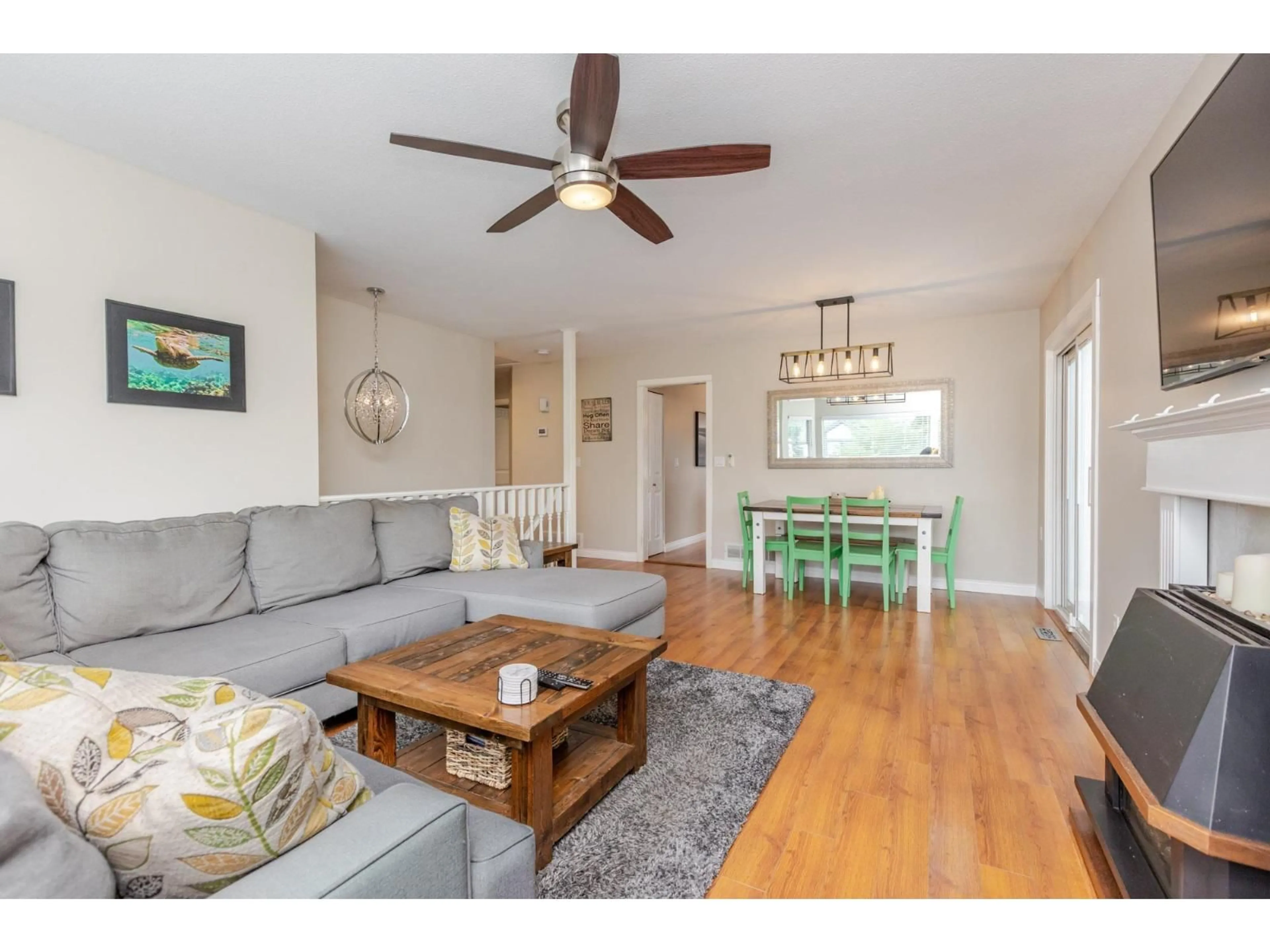Living room with furniture, wood/laminate floor for 6324 172A, Surrey British Columbia V3S6V4