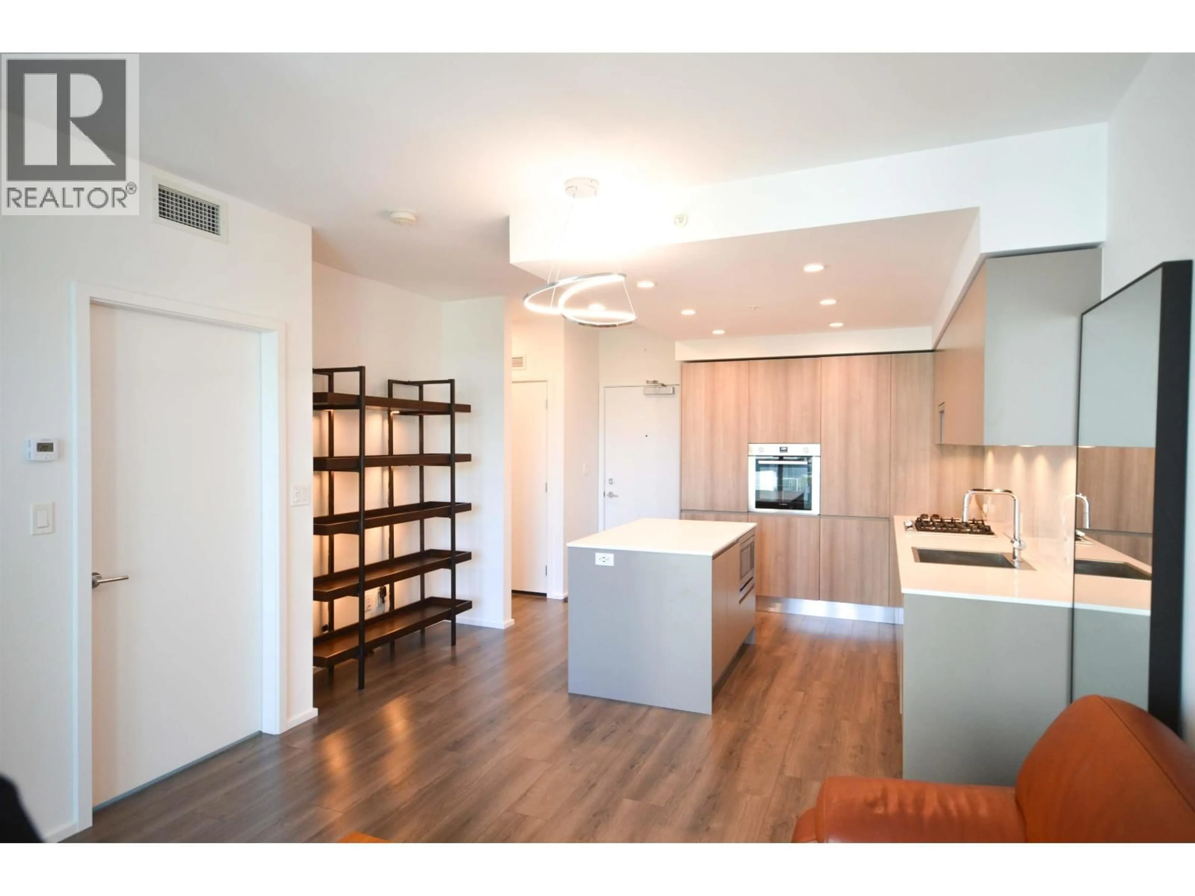 Open concept kitchen, wood/laminate floor for 1403 - 3833 EVERGREEN PLACE, Burnaby British Columbia V3J0M2