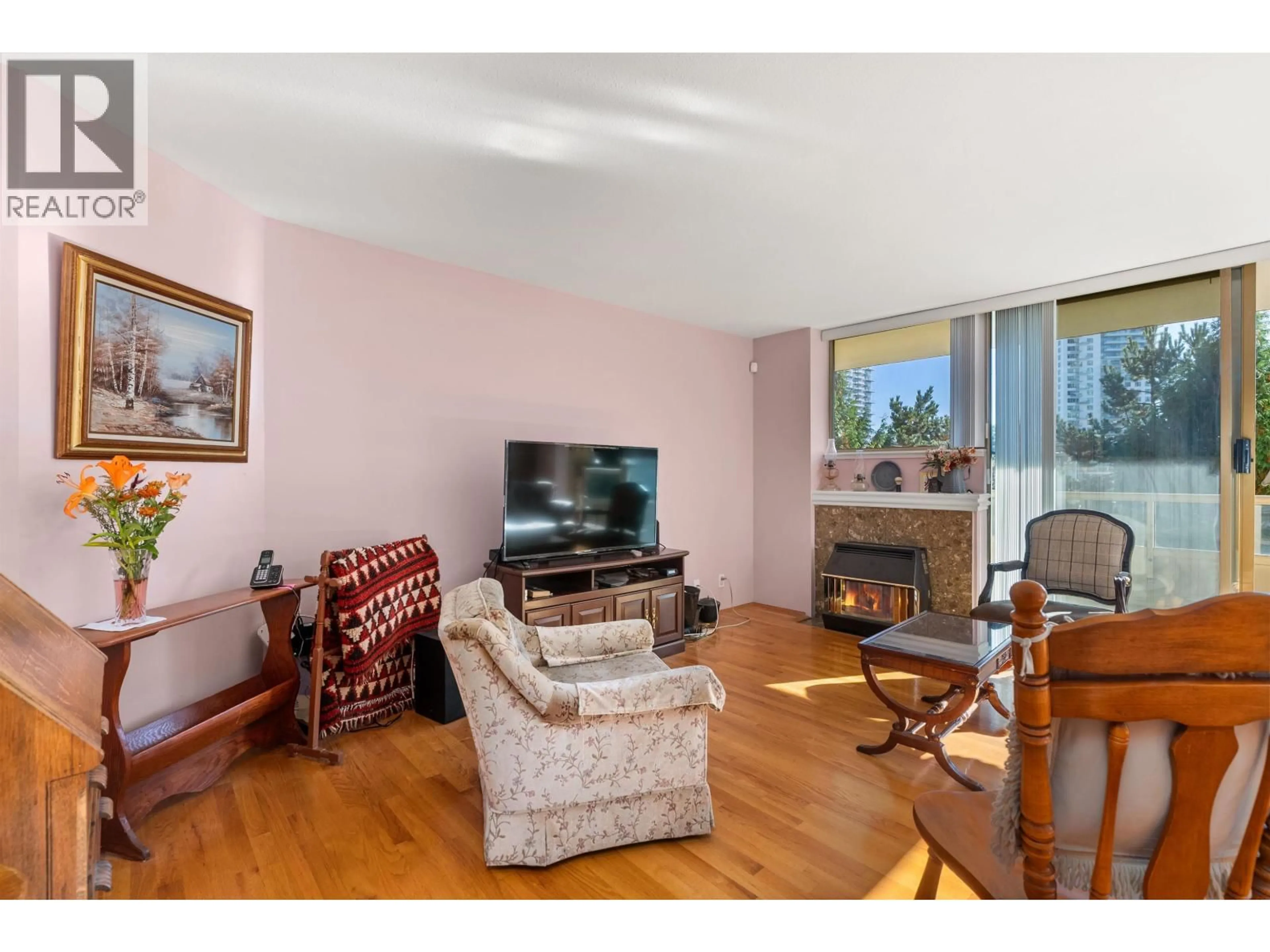 Living room with furniture, wood/laminate floor for 501 - 728 FARROW STREET, Coquitlam British Columbia V3J3S6