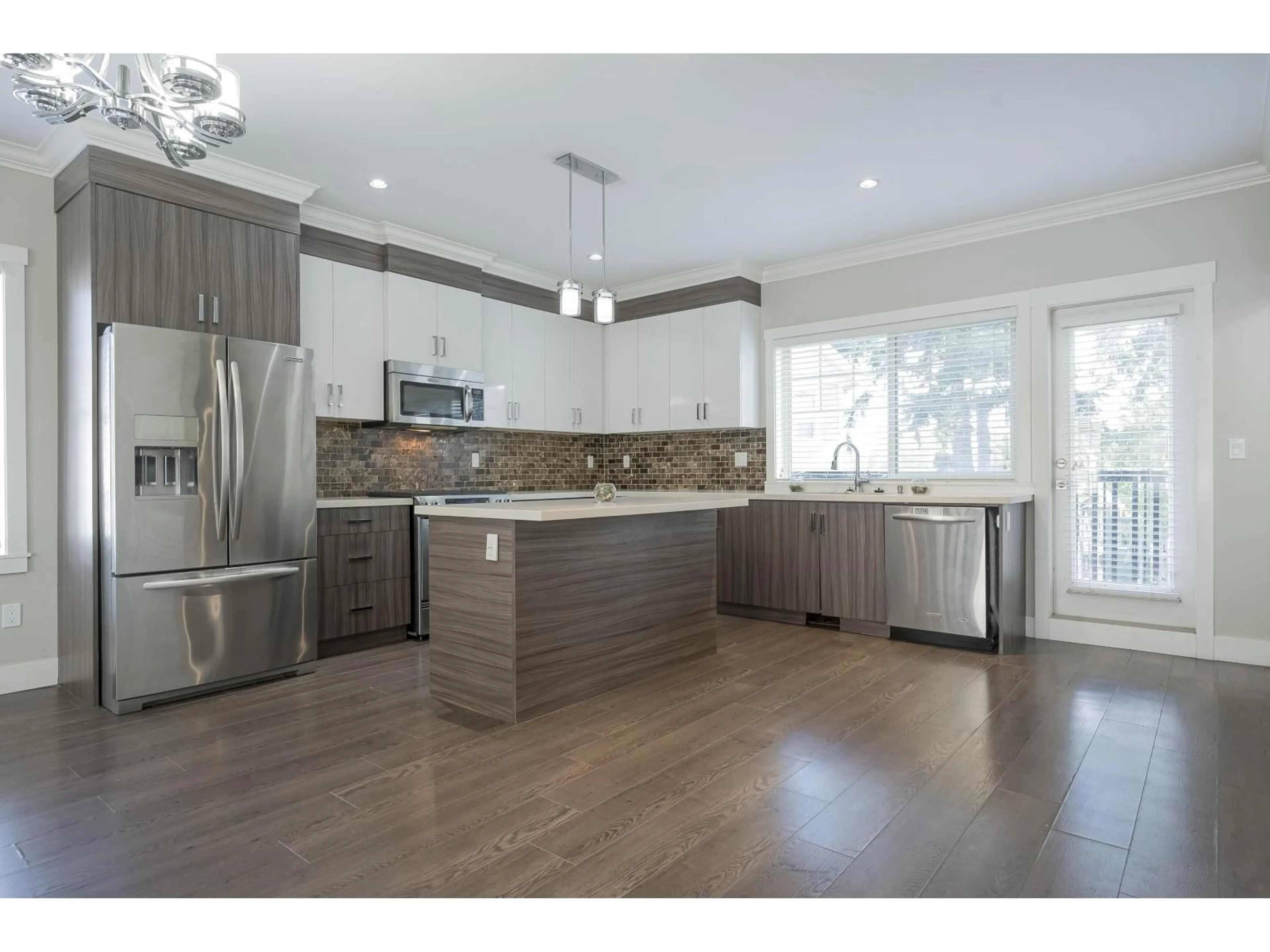 Open concept kitchen, wood/laminate floor for 68 - 19097 64, Surrey British Columbia V3S6X5