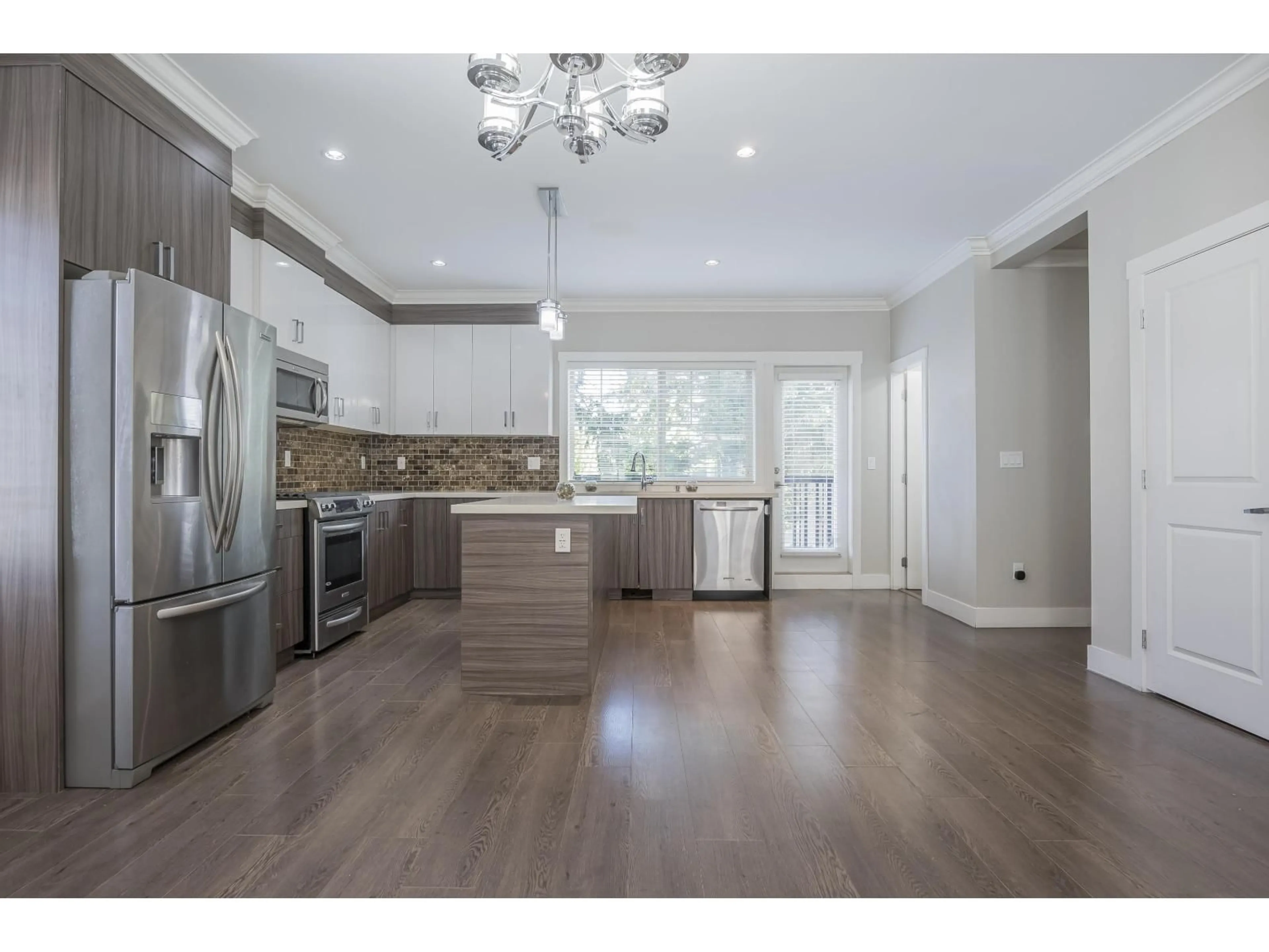 Open concept kitchen, wood/laminate floor for 68 - 19097 64, Surrey British Columbia V3S6X5