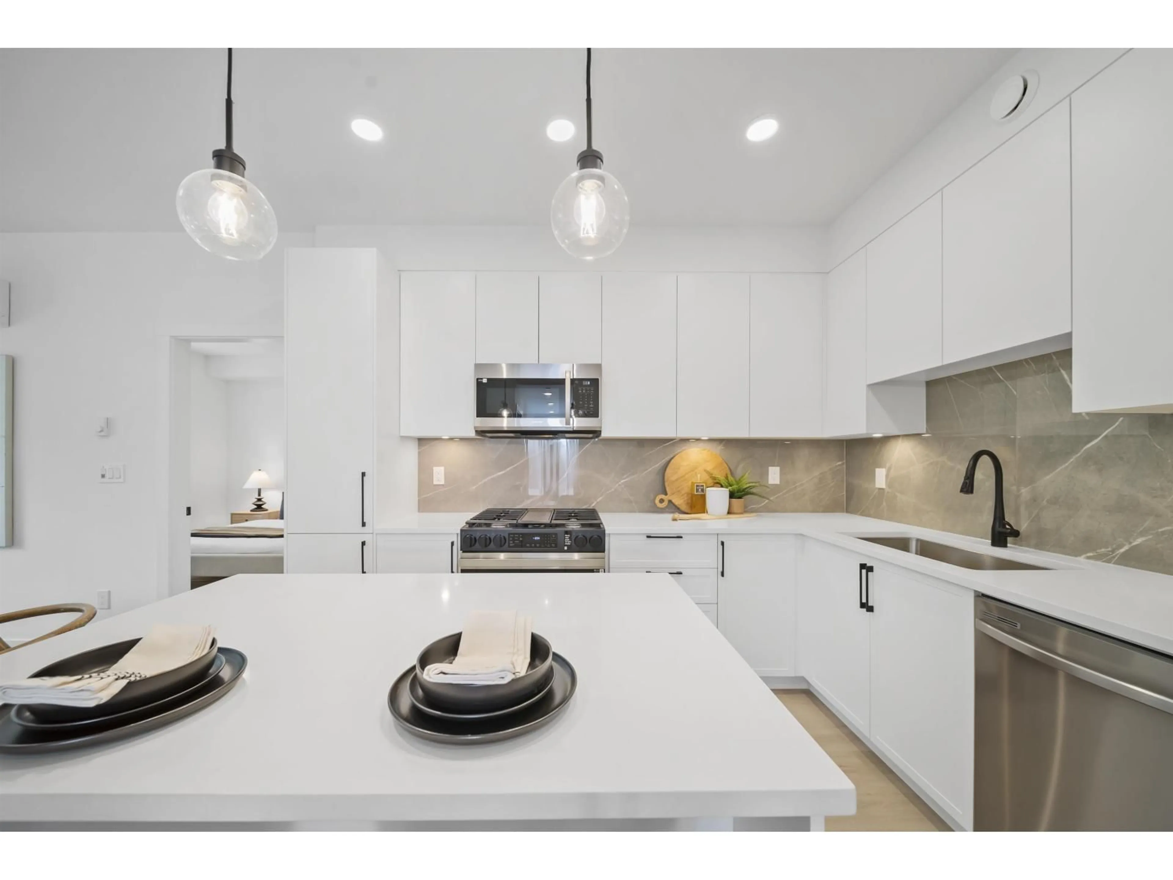 Open concept kitchen, ceramic/tile floor for 406 - 3465 146A, Surrey British Columbia V0V0V0