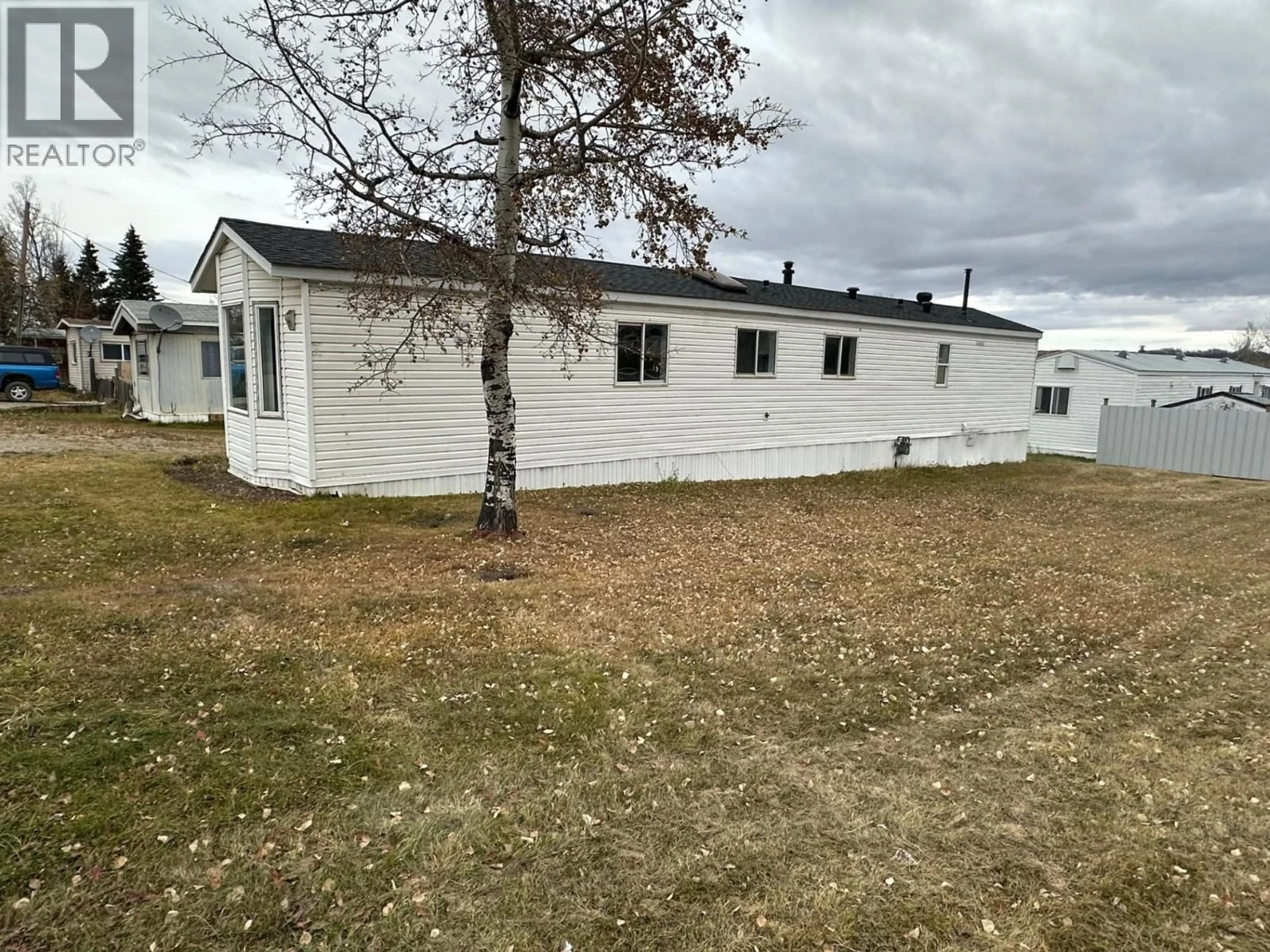 A pic from outside/outdoor area/front of a property/back of a property/a pic from drone, unknown for 89 - 12842 OLD HOPE ROAD, Charlie Lake British Columbia V1J4M7