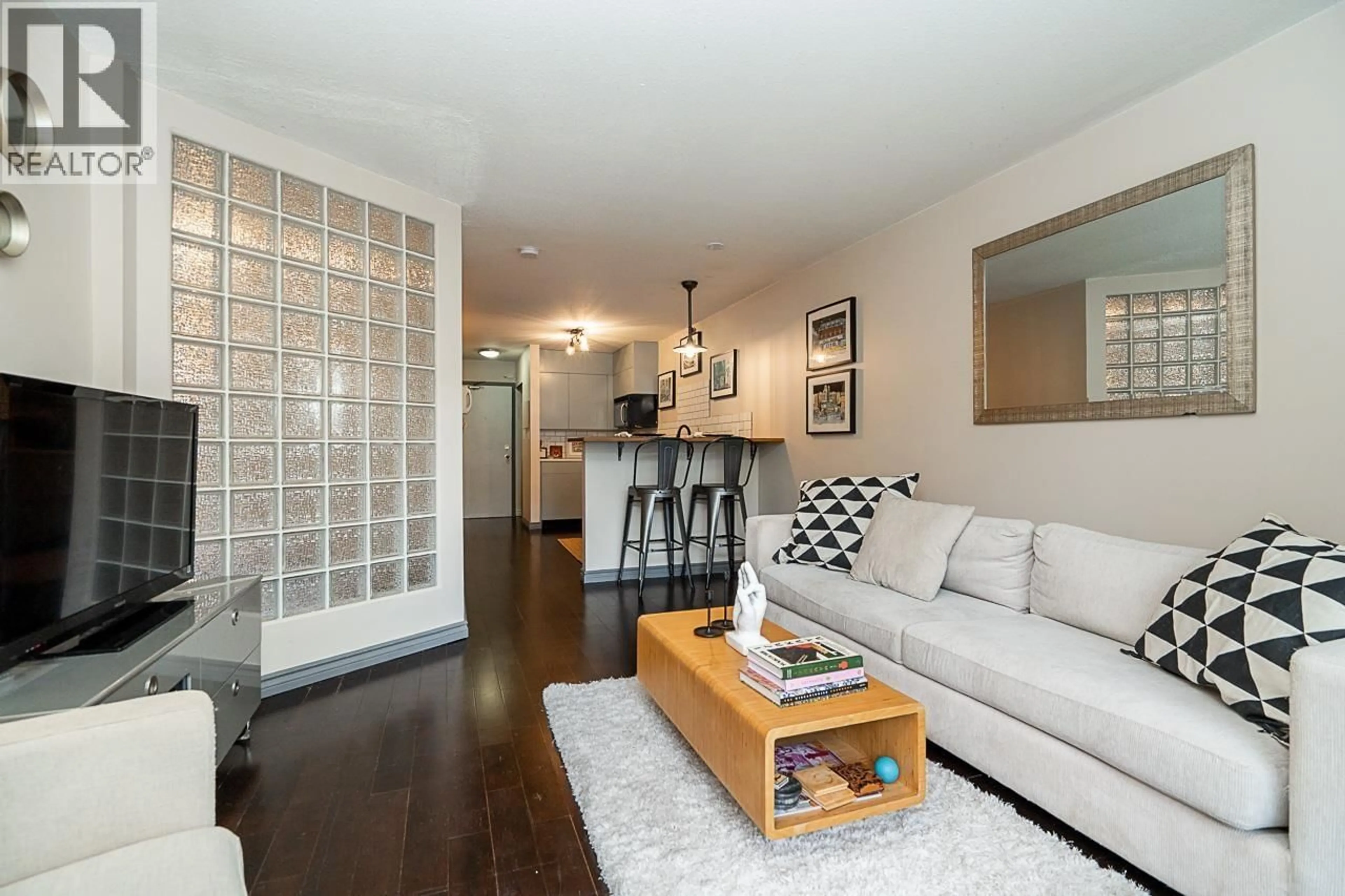 Living room with furniture, wood/laminate floor for 105 - 2255 ETON STREET, Vancouver British Columbia V5L1C9