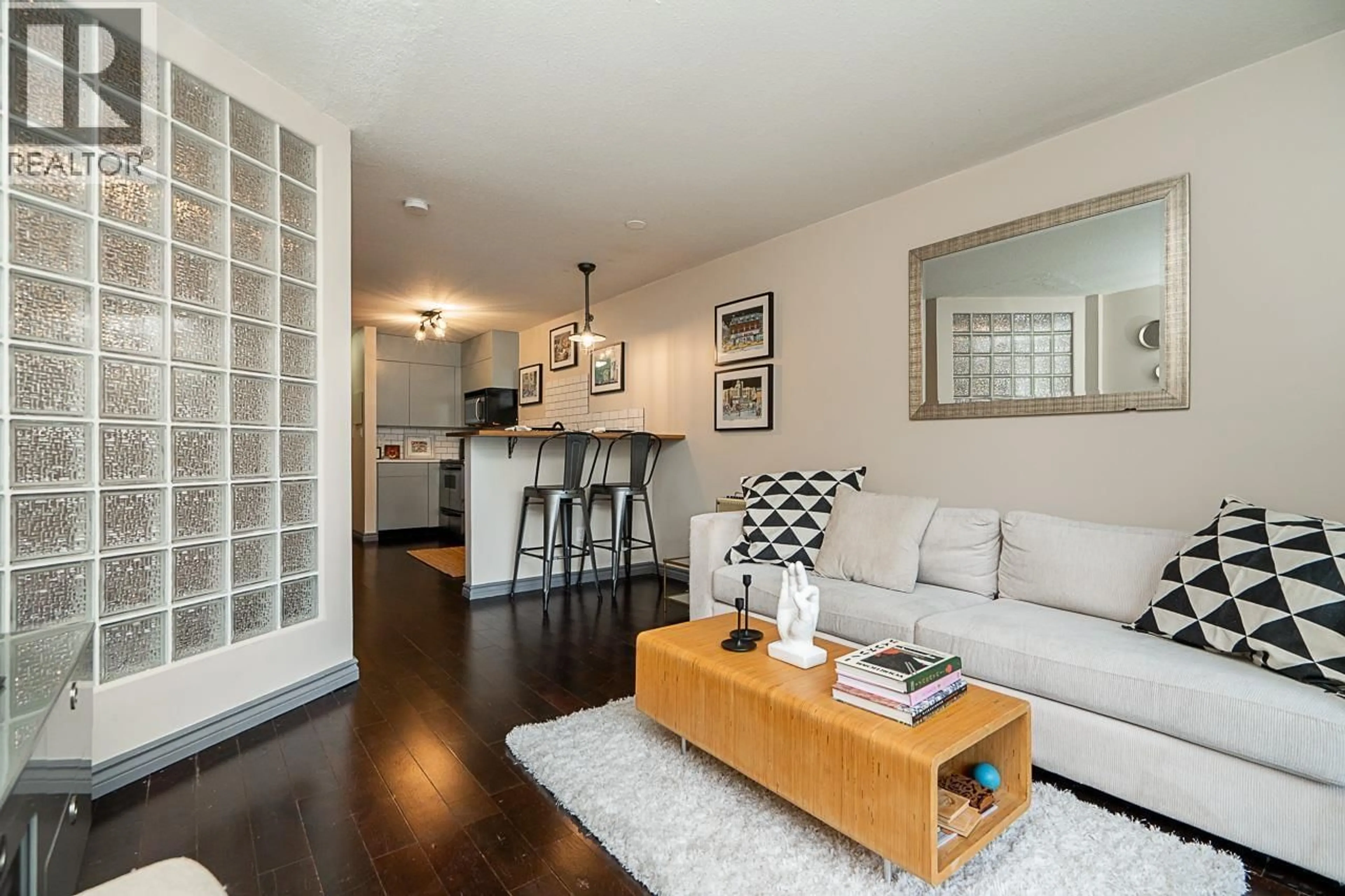 Living room with furniture, wood/laminate floor for 105 - 2255 ETON STREET, Vancouver British Columbia V5L1C9
