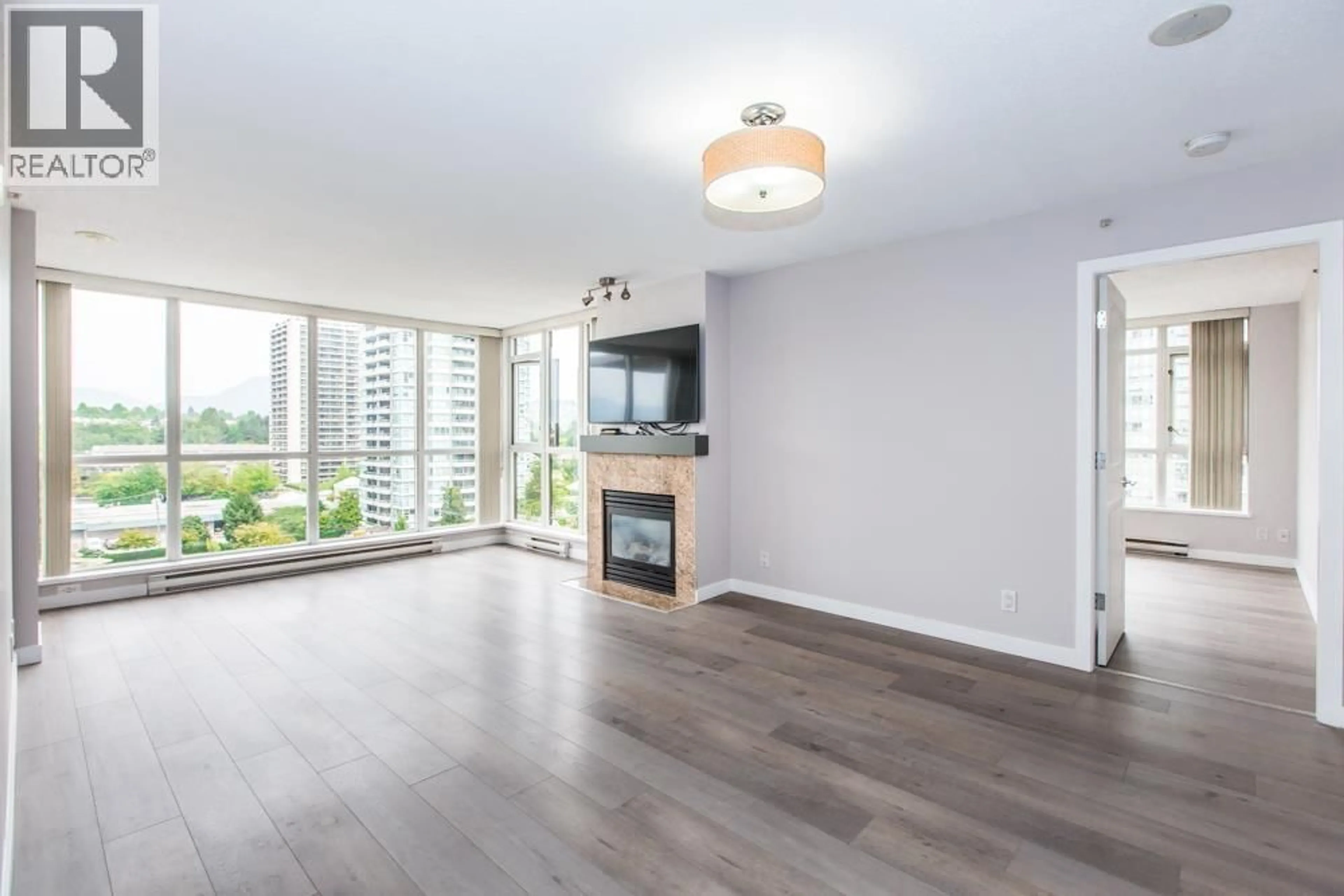 Living room with furniture, wood/laminate floor for 1406 - 2088 MADISON AVENUE, Burnaby British Columbia V5C6T5
