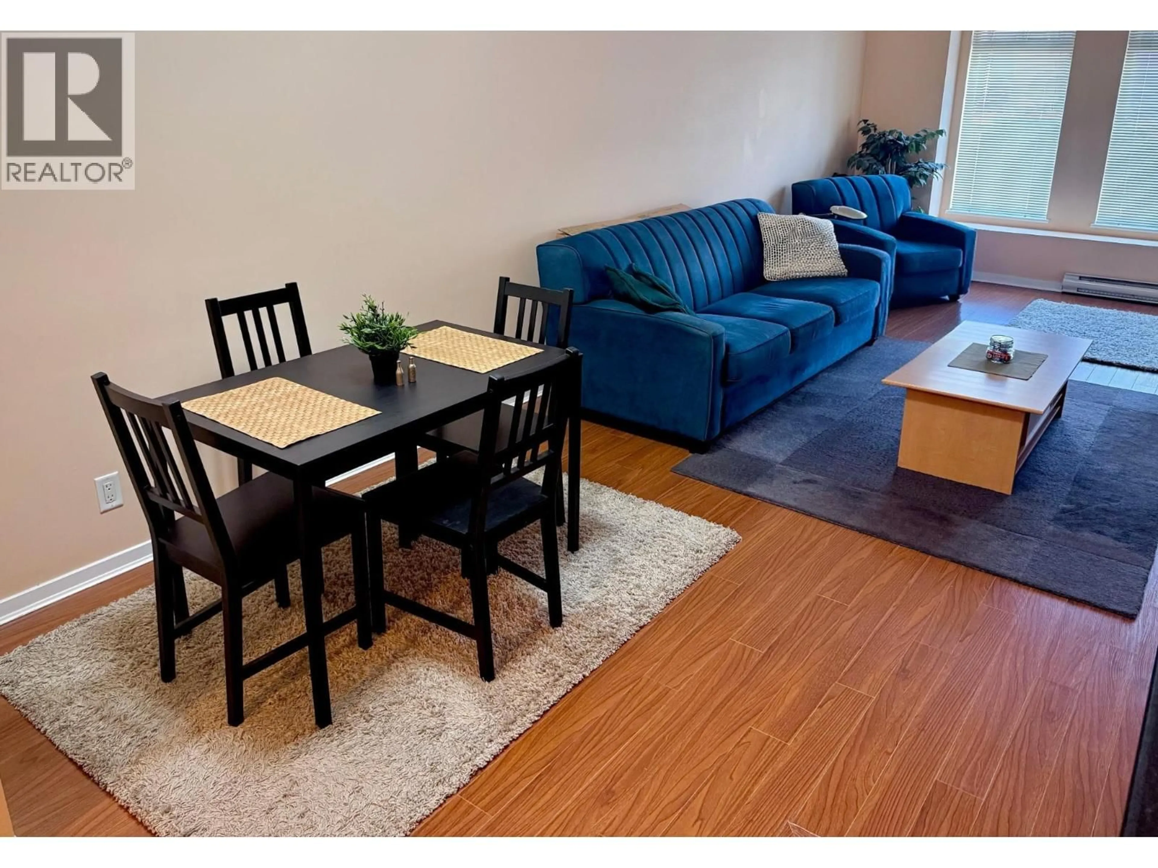 Living room with furniture, wood/laminate floor for 305 - 2488 WELCHER AVENUE, Port Coquitlam British Columbia V3C1X7