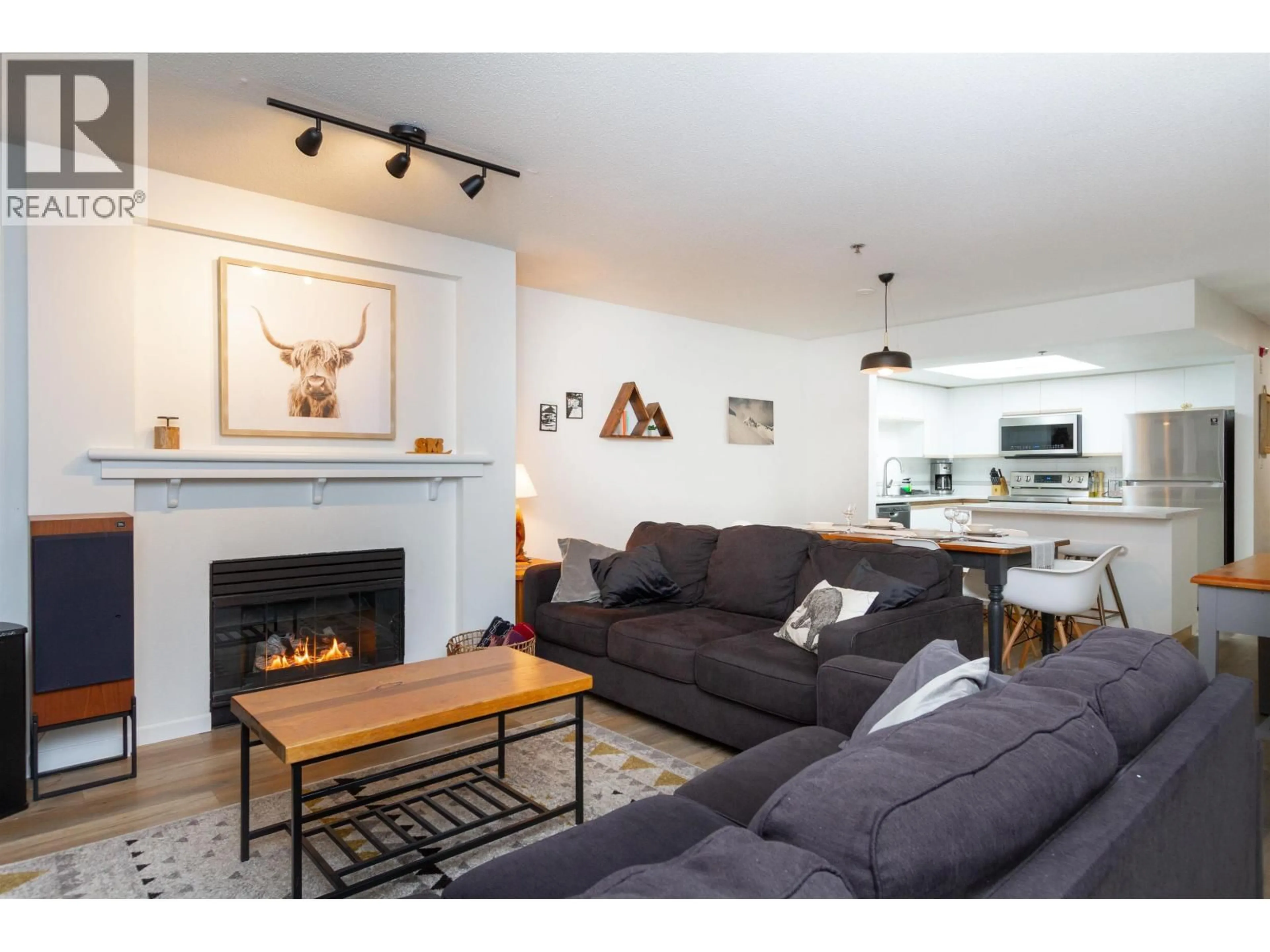 Living room with furniture, wood/laminate floor for 122 - 3309 PTARMIGAN PLACE, Whistler British Columbia V8E0V6