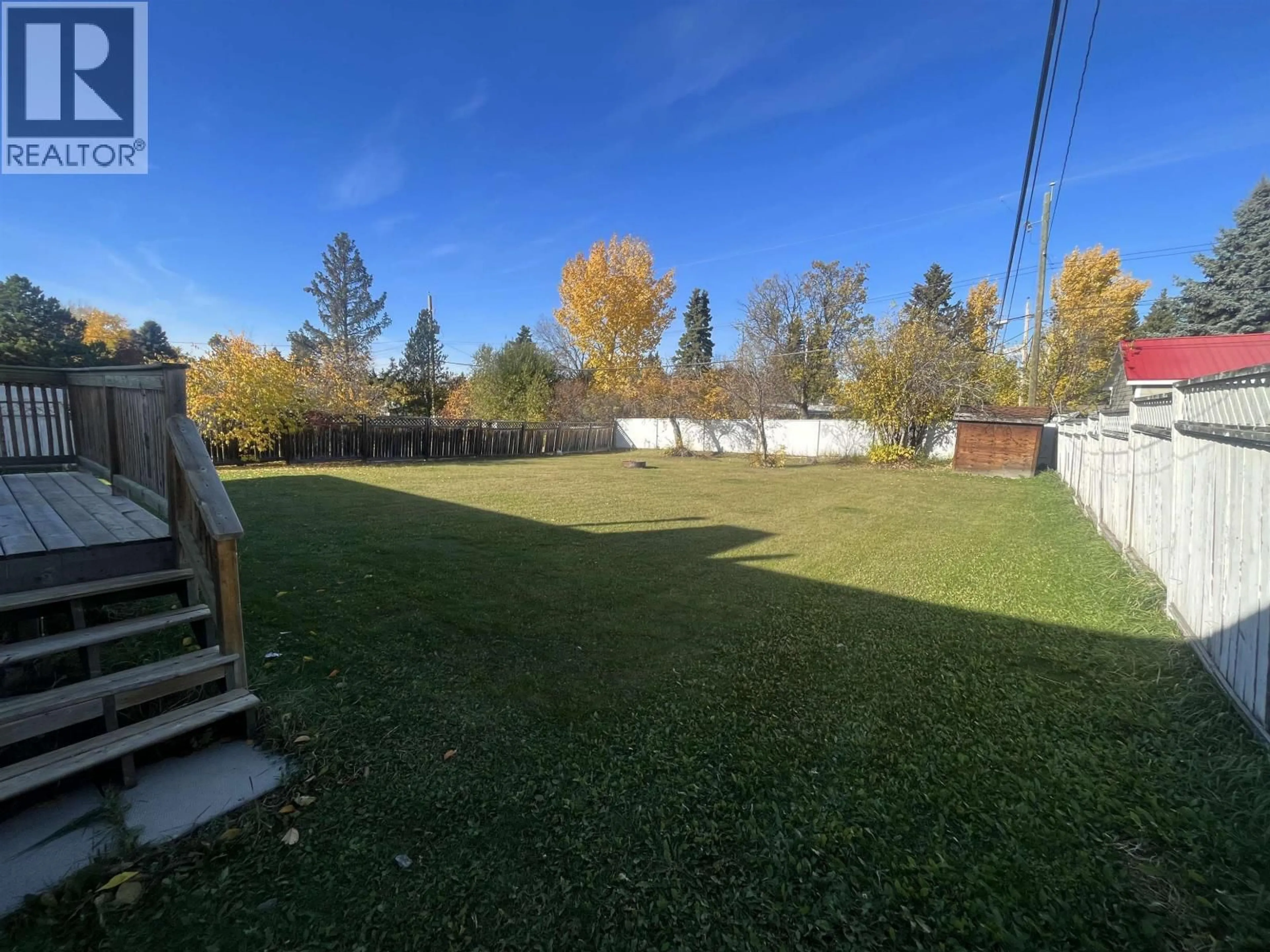 A pic from outside/outdoor area/front of a property/back of a property/a pic from drone, forest/trees view for 9312 112 AVENUE, Fort St. John British Columbia V1J2V9