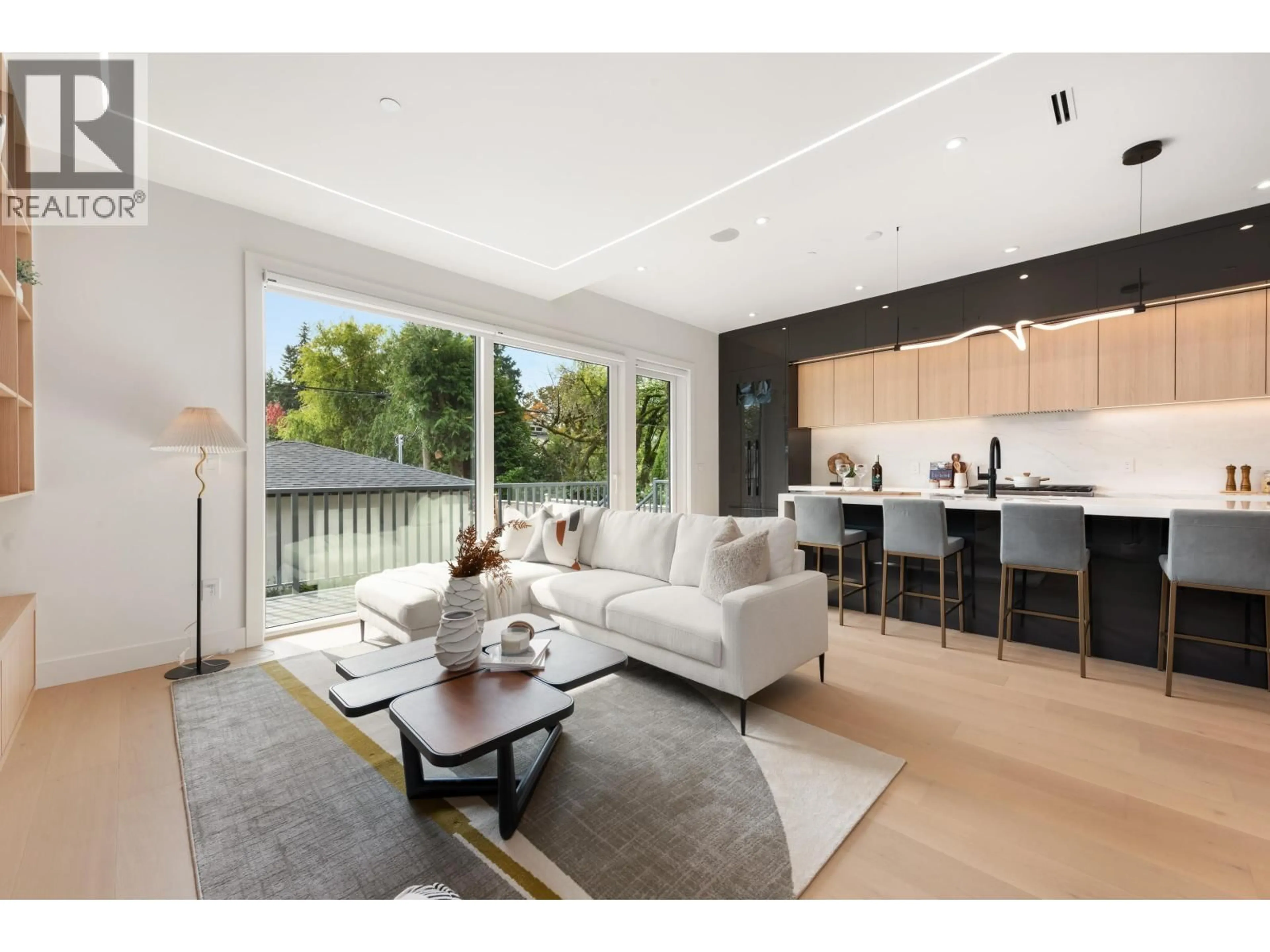 Living room with furniture, wood/laminate floor for 2 - 3232 38TH AVENUE, Vancouver British Columbia V6N2X6