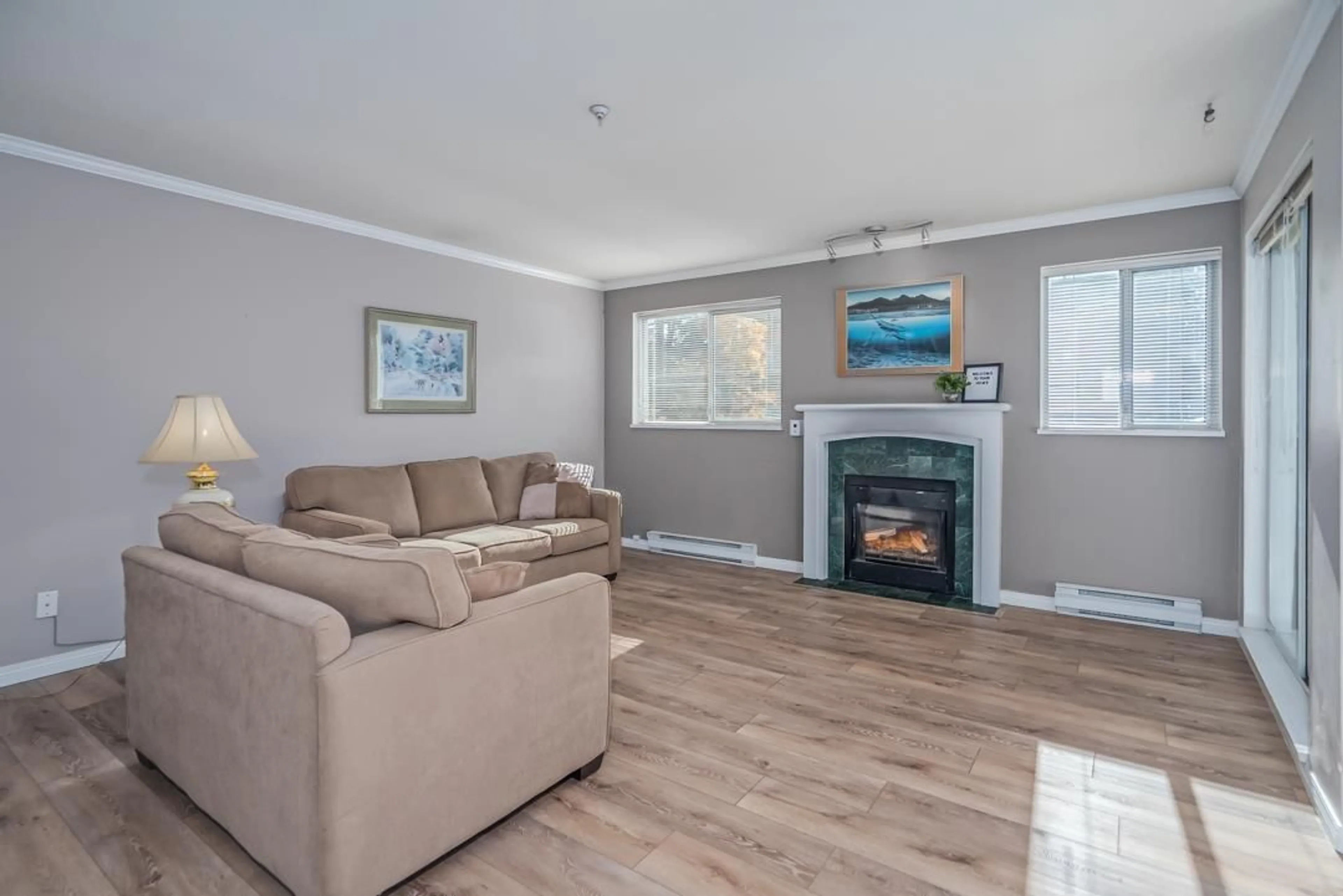 Living room with furniture, wood/laminate floor for 203 - 13733 74, Surrey British Columbia V3W1B8