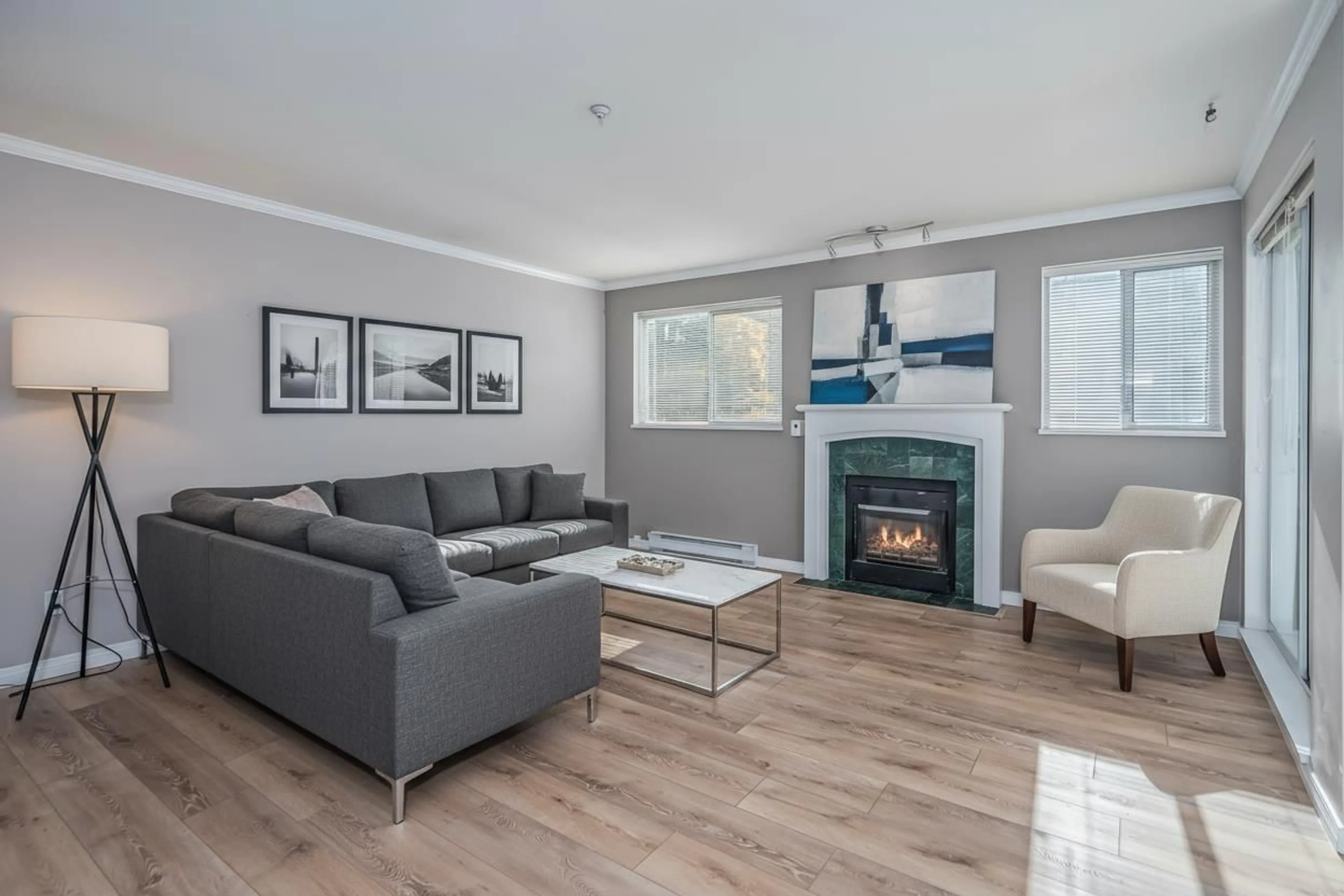 Living room with furniture, wood/laminate floor for 203 - 13733 74, Surrey British Columbia V3W1B8
