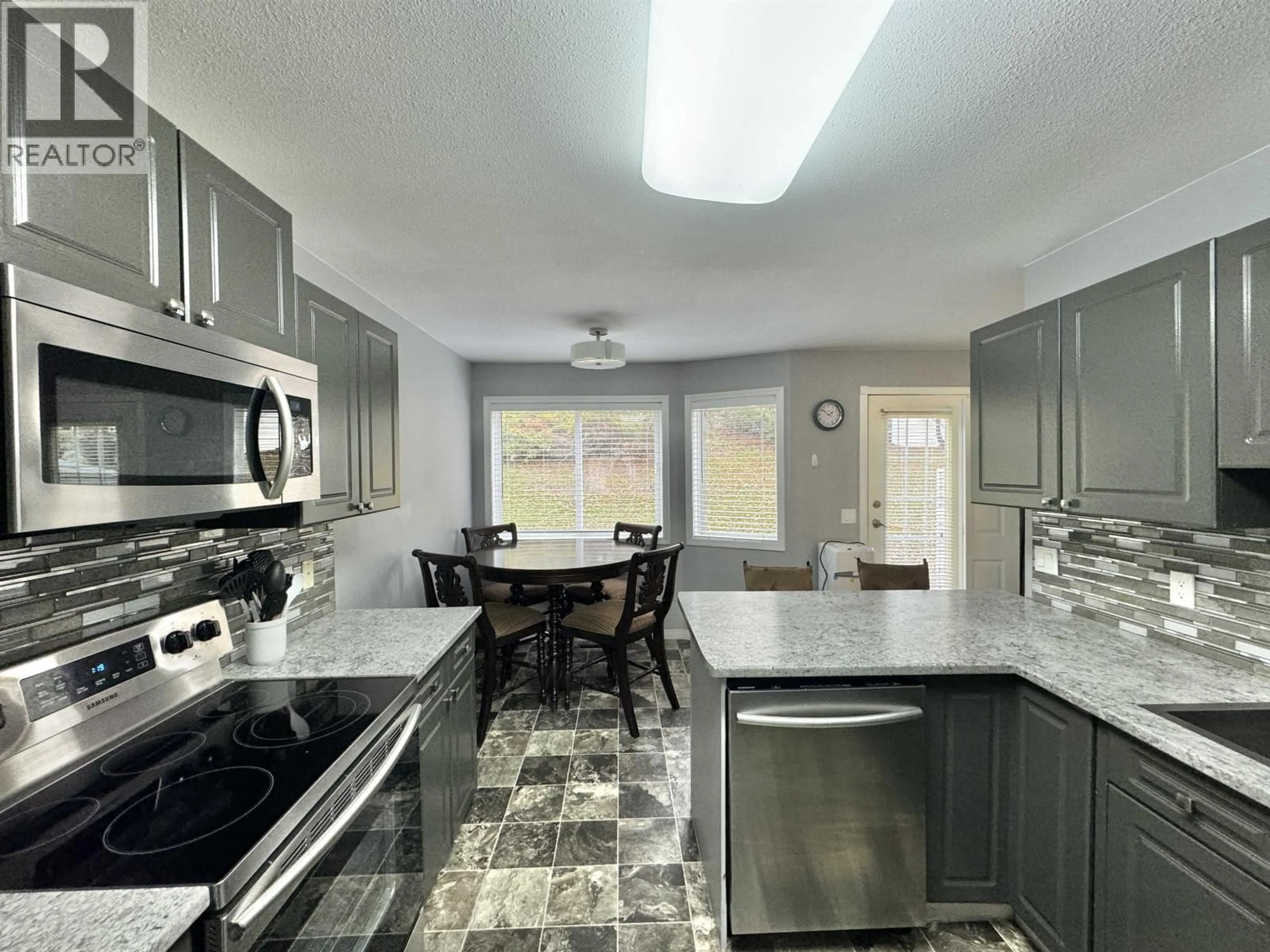 Open concept kitchen, ceramic/tile floor for 15 - 350 PEARKES DRIVE, Williams Lake British Columbia V2G4T2