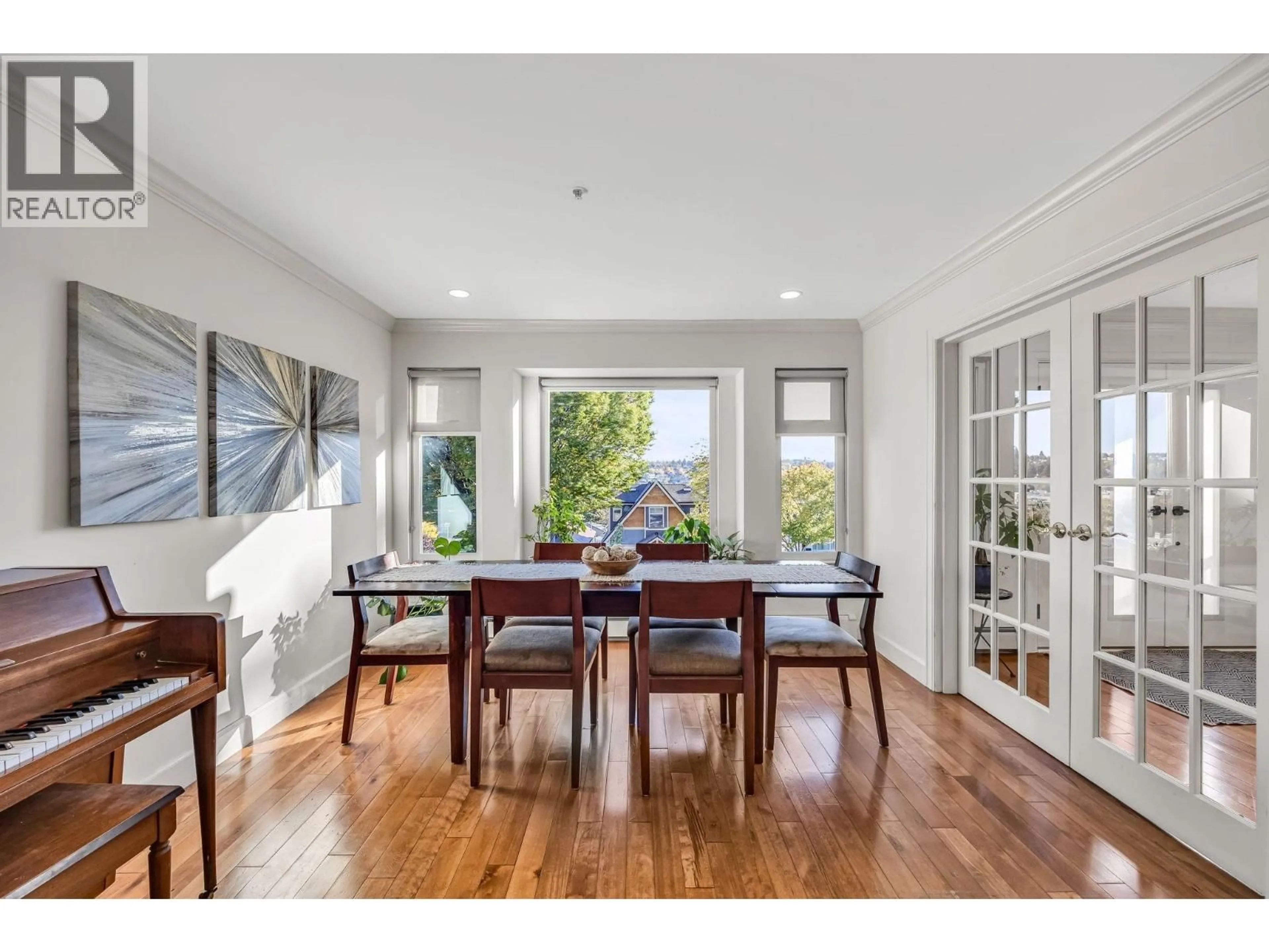 Dining room, wood/laminate floor for 3191 EIGHT AVENUE, Vancouver British Columbia V5M1X5