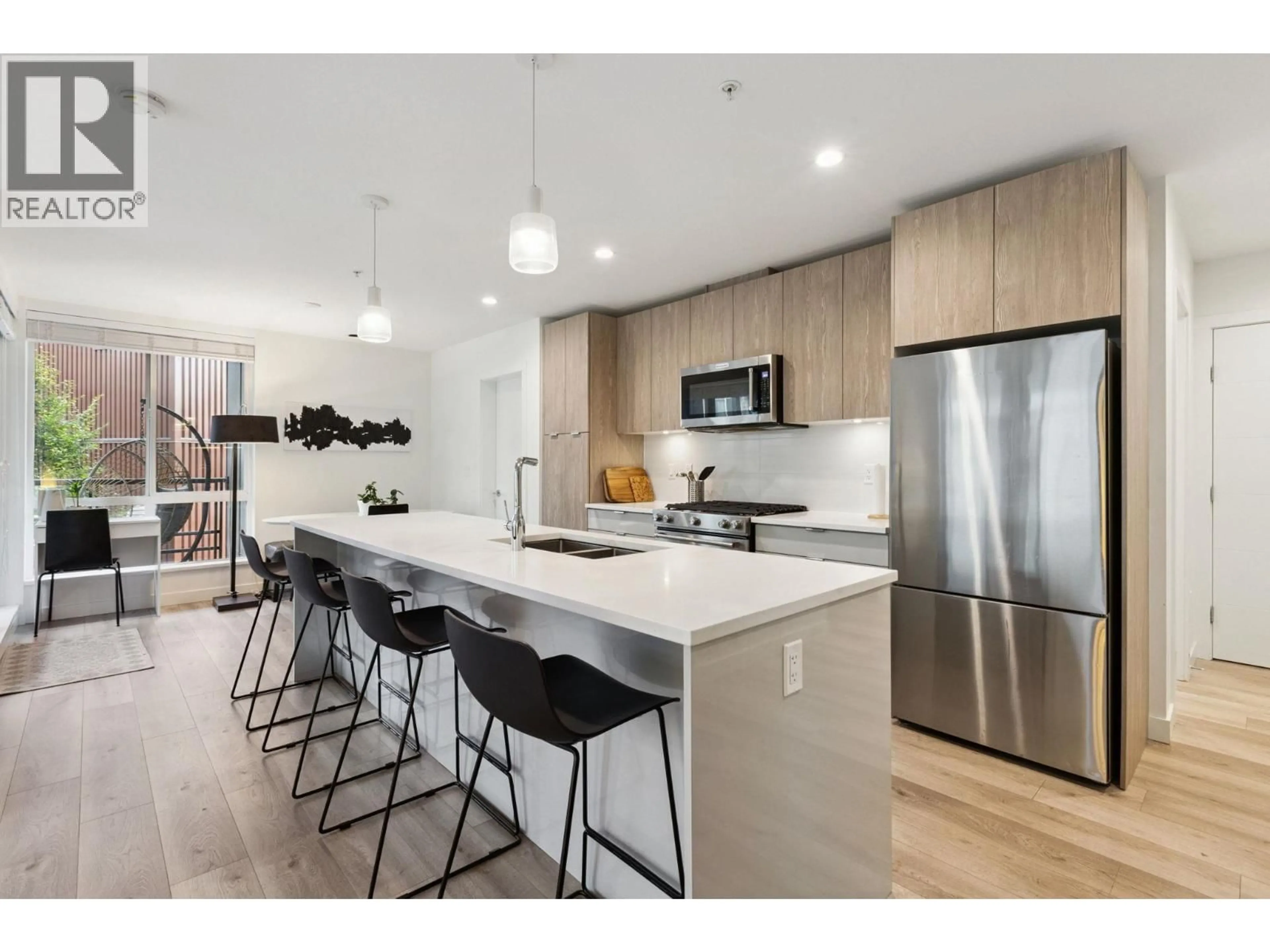 Open concept kitchen, unknown for 309 - 128 8TH STREET, North Vancouver British Columbia V7L0H2