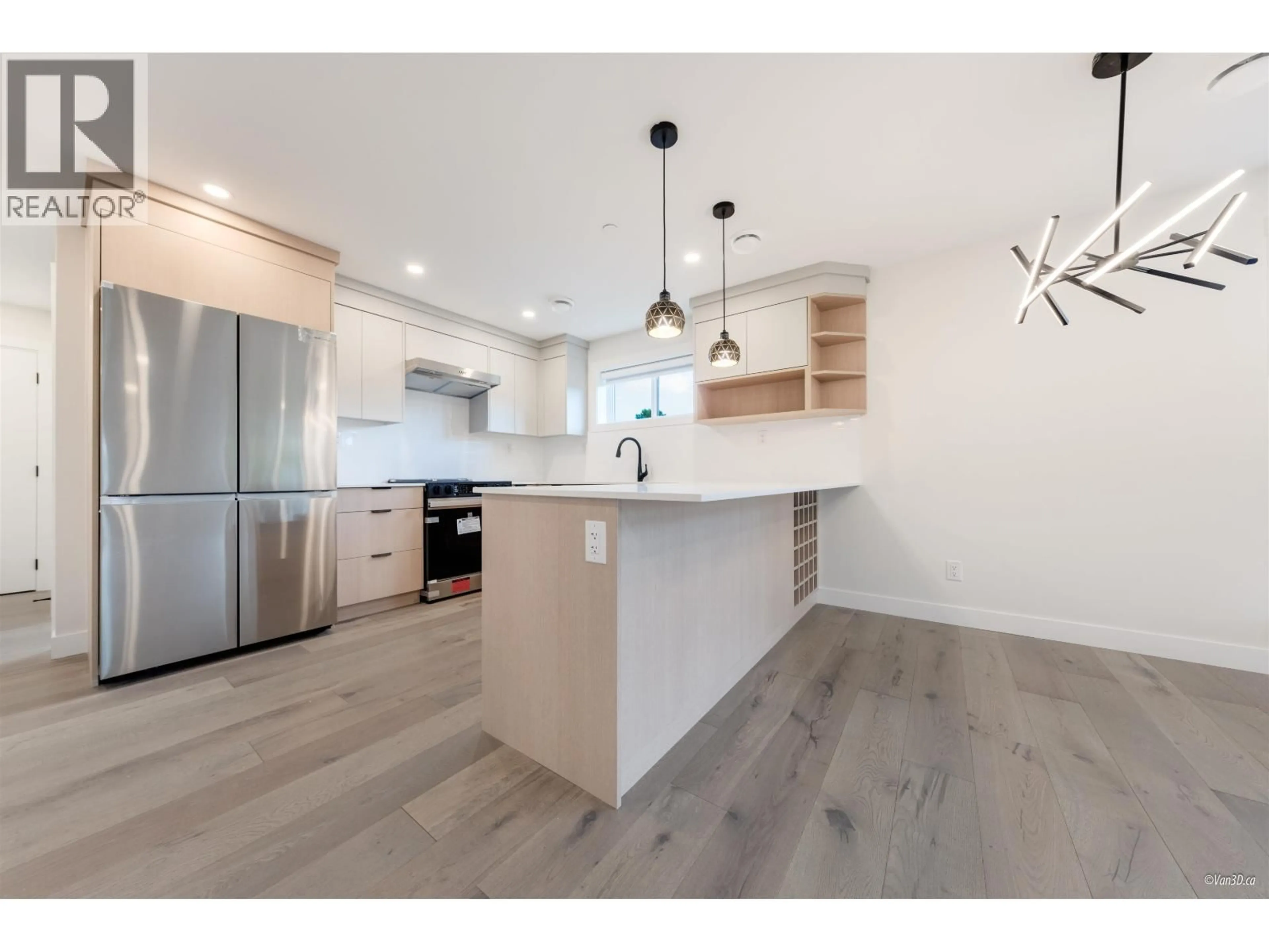 Open concept kitchen, wood/laminate floor for 202 - 5092 SLOCAN STREET, Vancouver British Columbia V5R2A5