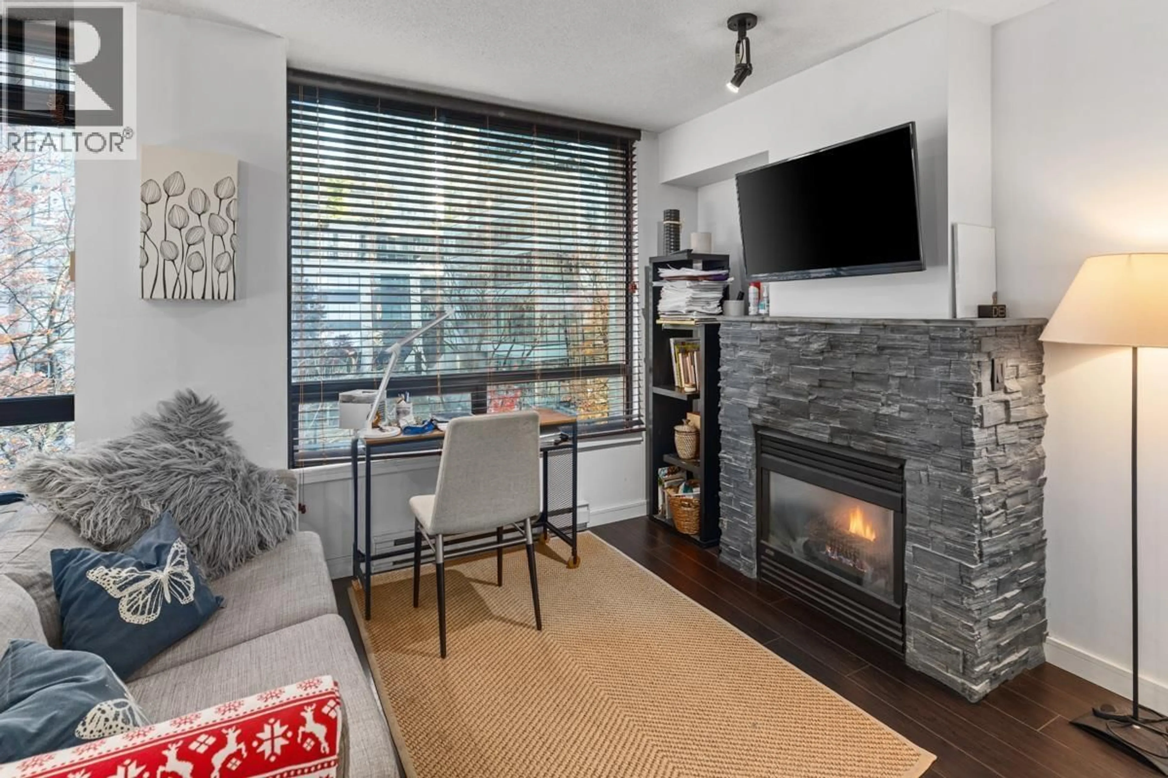 Living room with furniture, wood/laminate floor for 403 - 1003 BURNABY STREET, Vancouver British Columbia V6E4R7