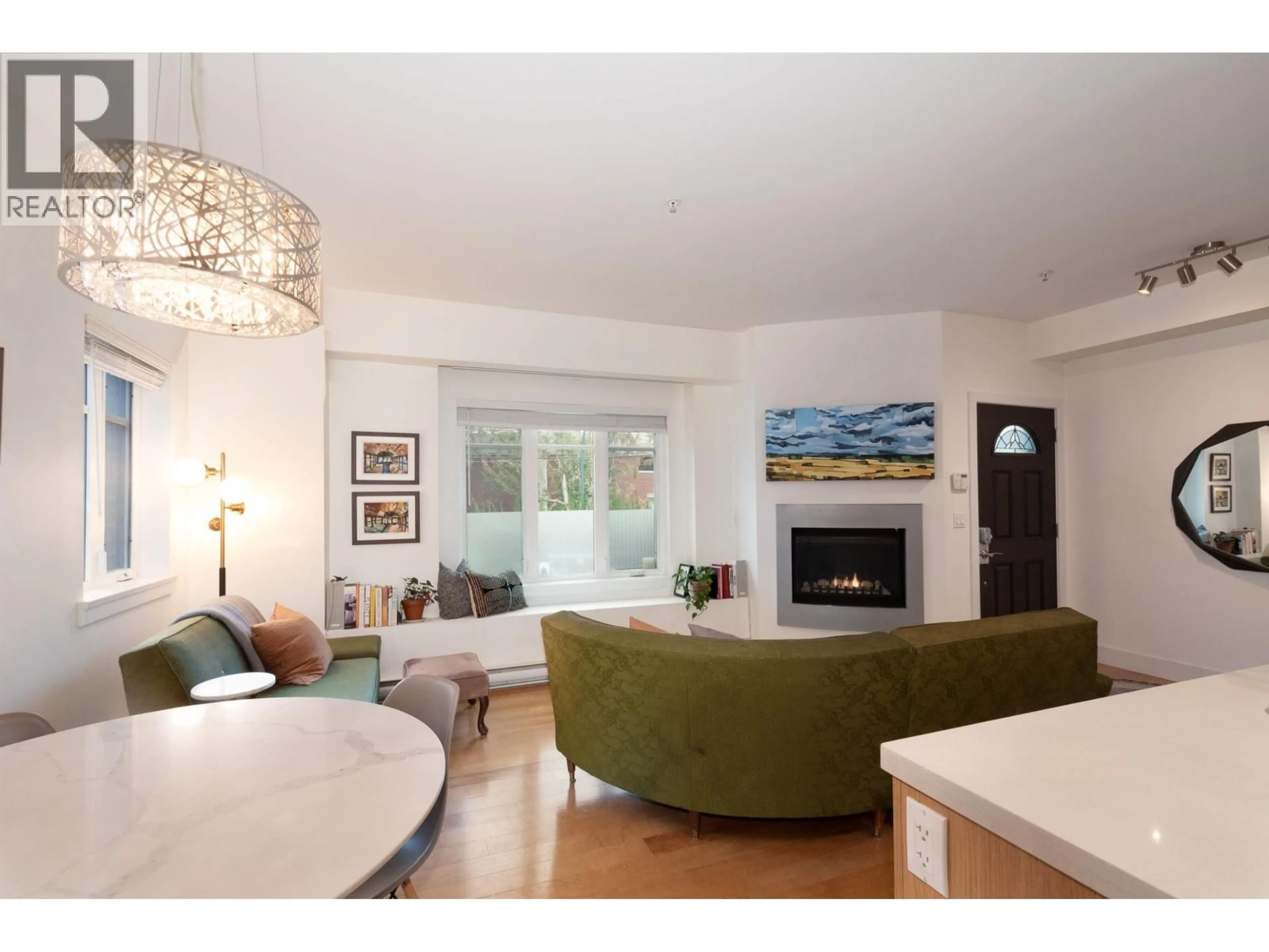 Living room with furniture, wood/laminate floor for 468 5TH AVENUE, Vancouver British Columbia V5T1H9