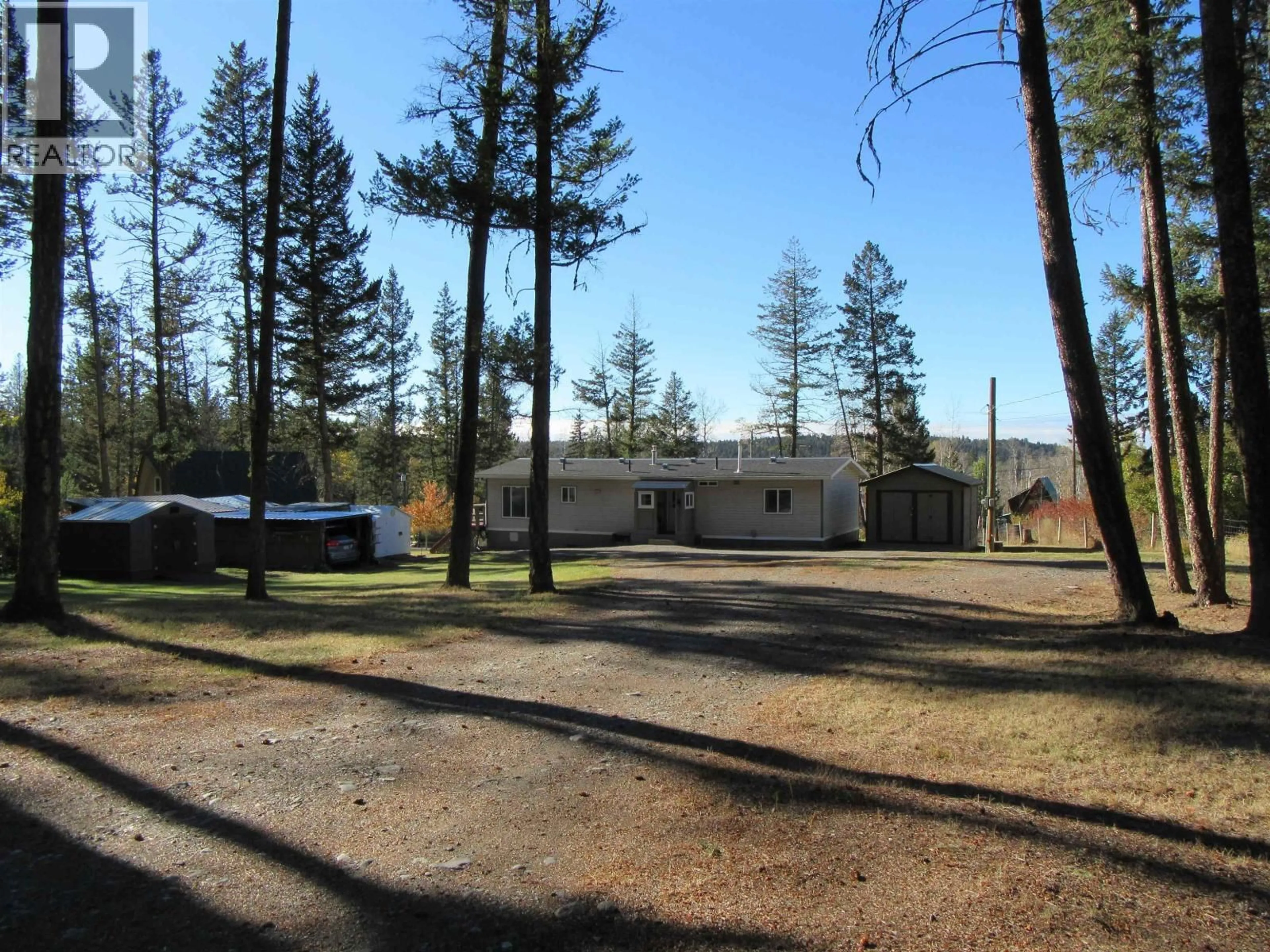 A pic from outside/outdoor area/front of a property/back of a property/a pic from drone, forest/trees view for 4866 KEMMI CRESCENT, 108 Mile Ranch British Columbia V0K2Z0