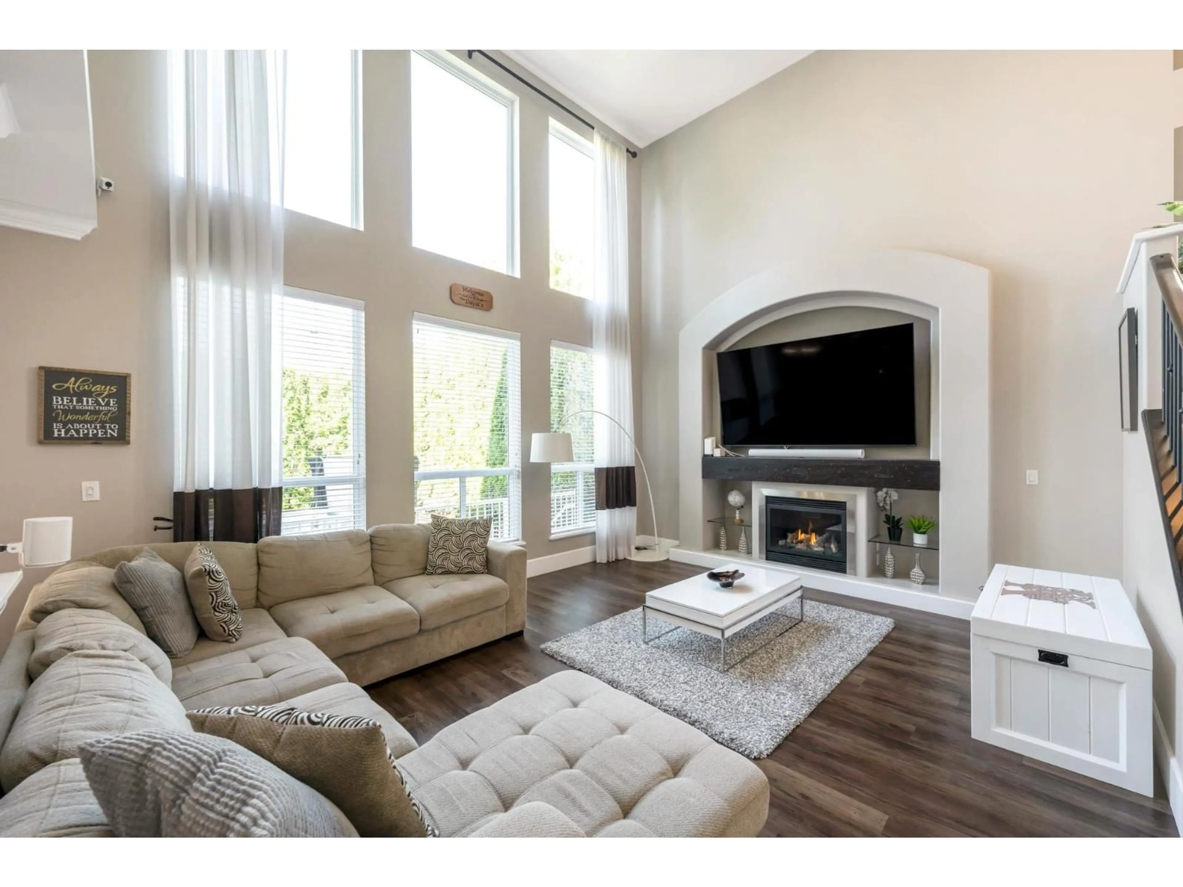 Living room with furniture, wood/laminate floor for 8343 209A, Langley British Columbia V2Y0A5