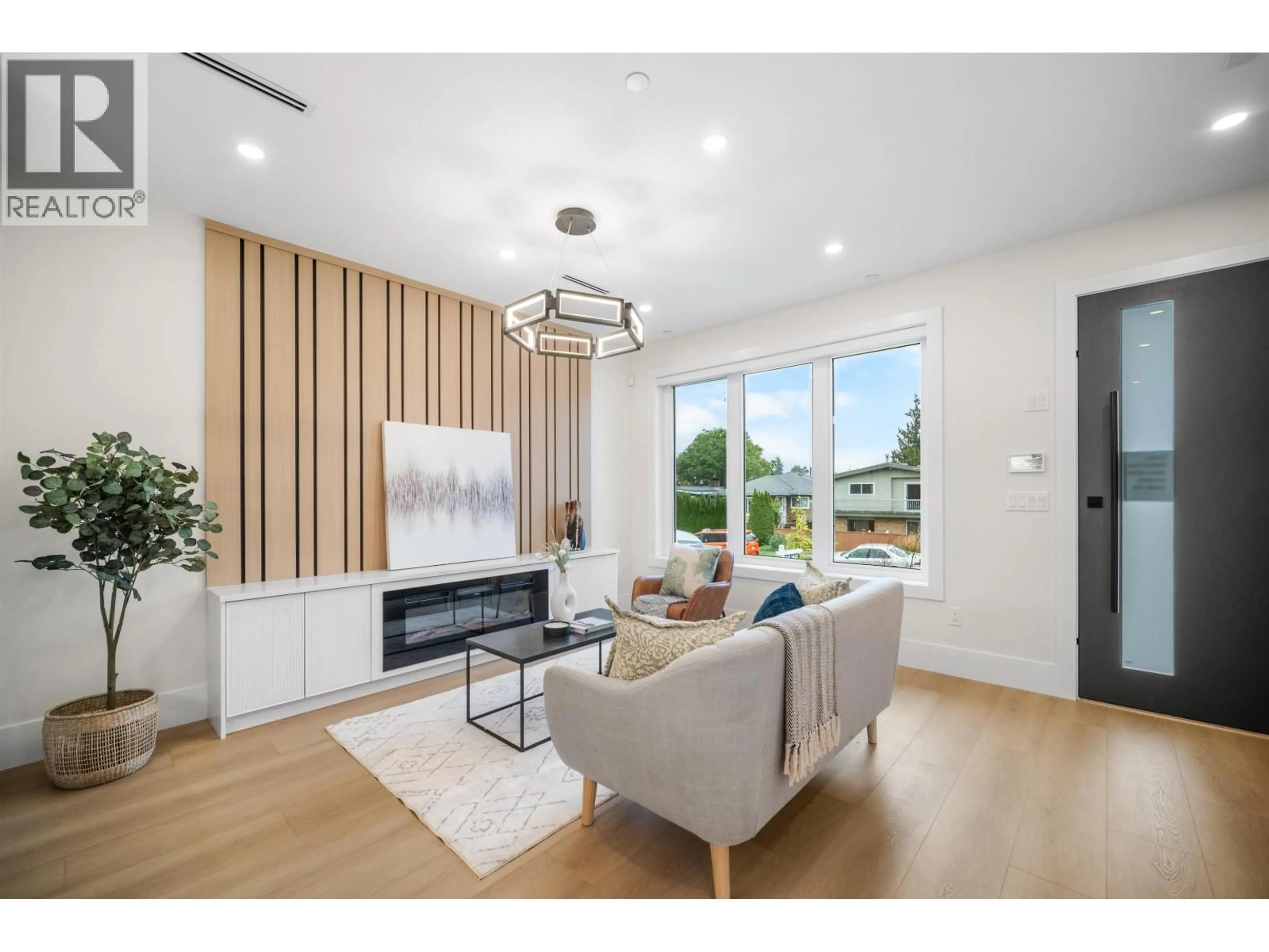 Living room with furniture, wood/laminate floor for 1 - 5378 CULLODEN STREET, Vancouver British Columbia V5W3R6