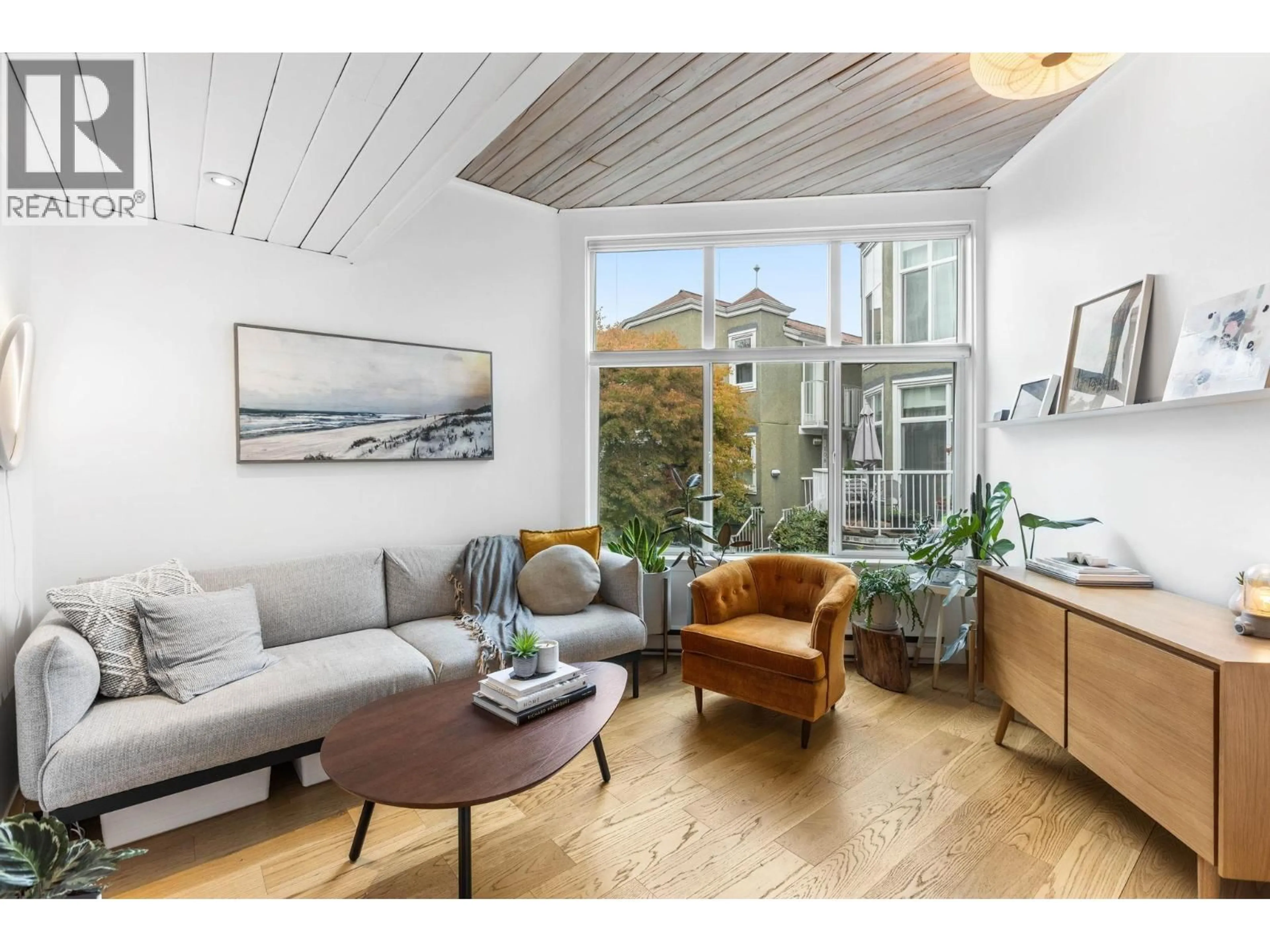 Living room with furniture, wood/laminate floor for 212 - 1045 8TH AVENUE, Vancouver British Columbia V6H1C3
