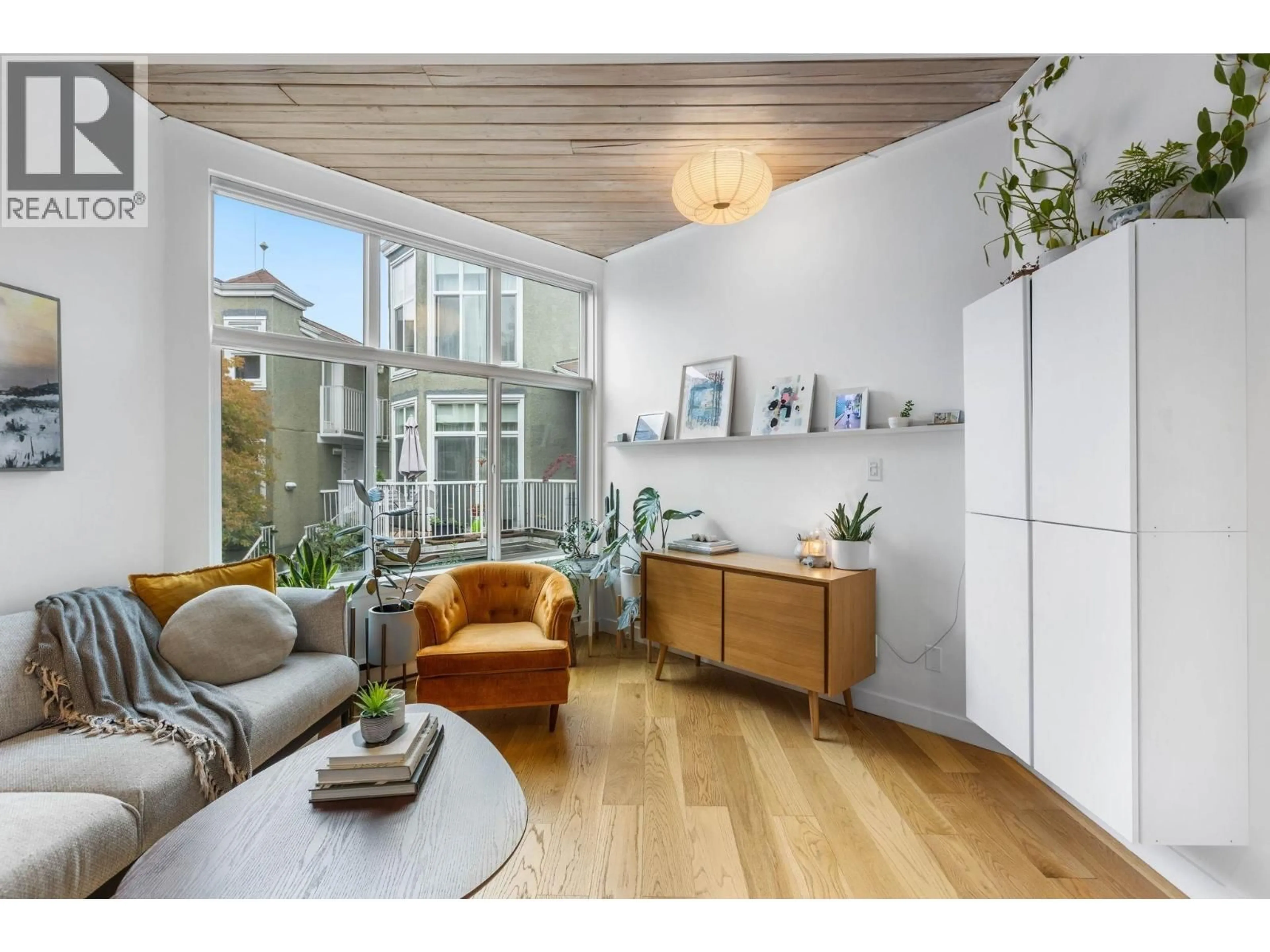 Living room with furniture, wood/laminate floor for 212 - 1045 8TH AVENUE, Vancouver British Columbia V6H1C3