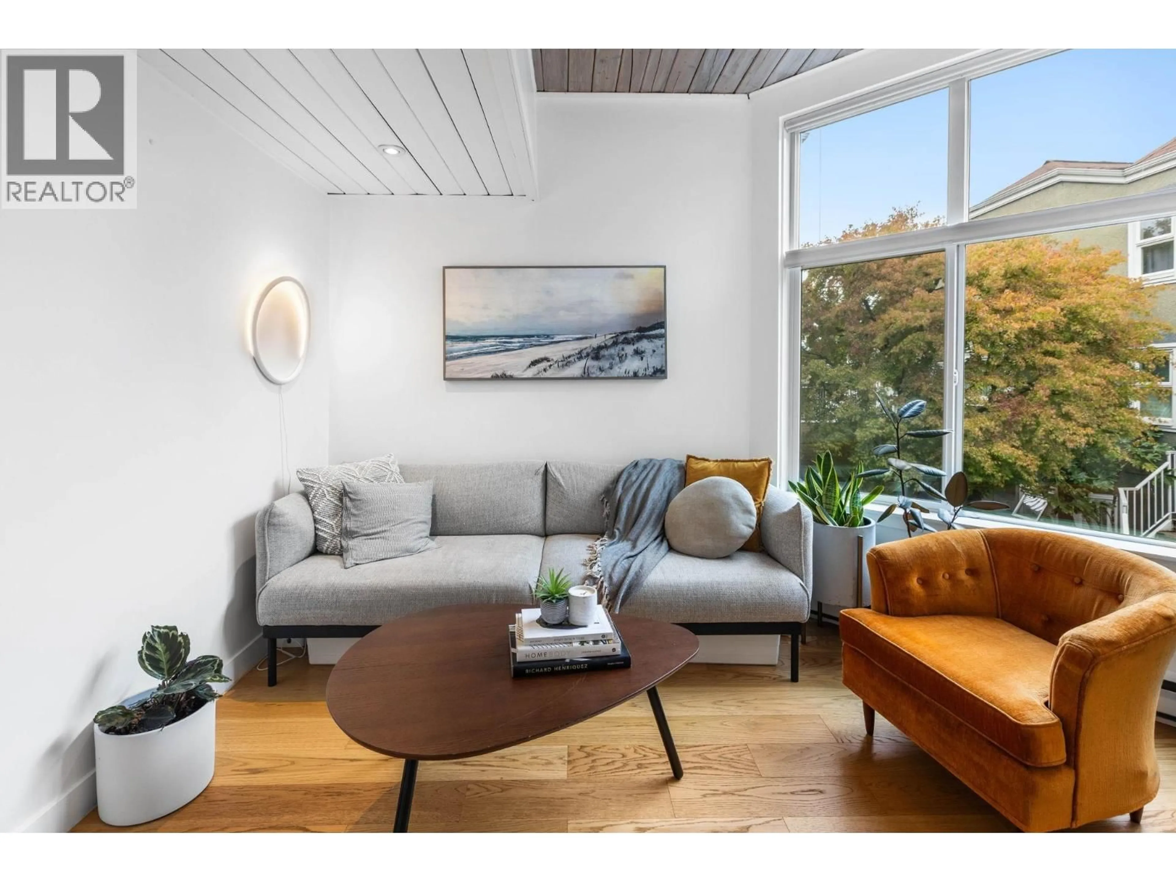 Living room with furniture, wood/laminate floor for 212 - 1045 8TH AVENUE, Vancouver British Columbia V6H1C3