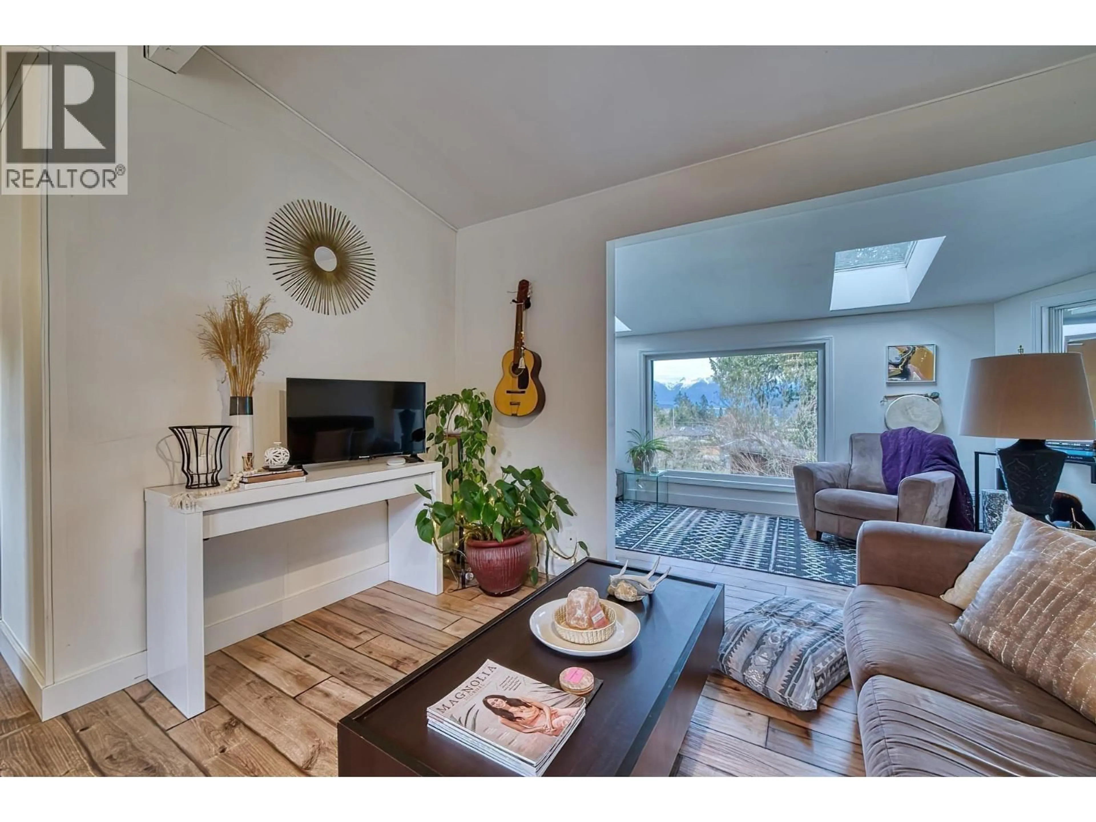 Living room with furniture, wood/laminate floor for 640 WYNGAERT ROAD, Gibsons British Columbia V0N1V9