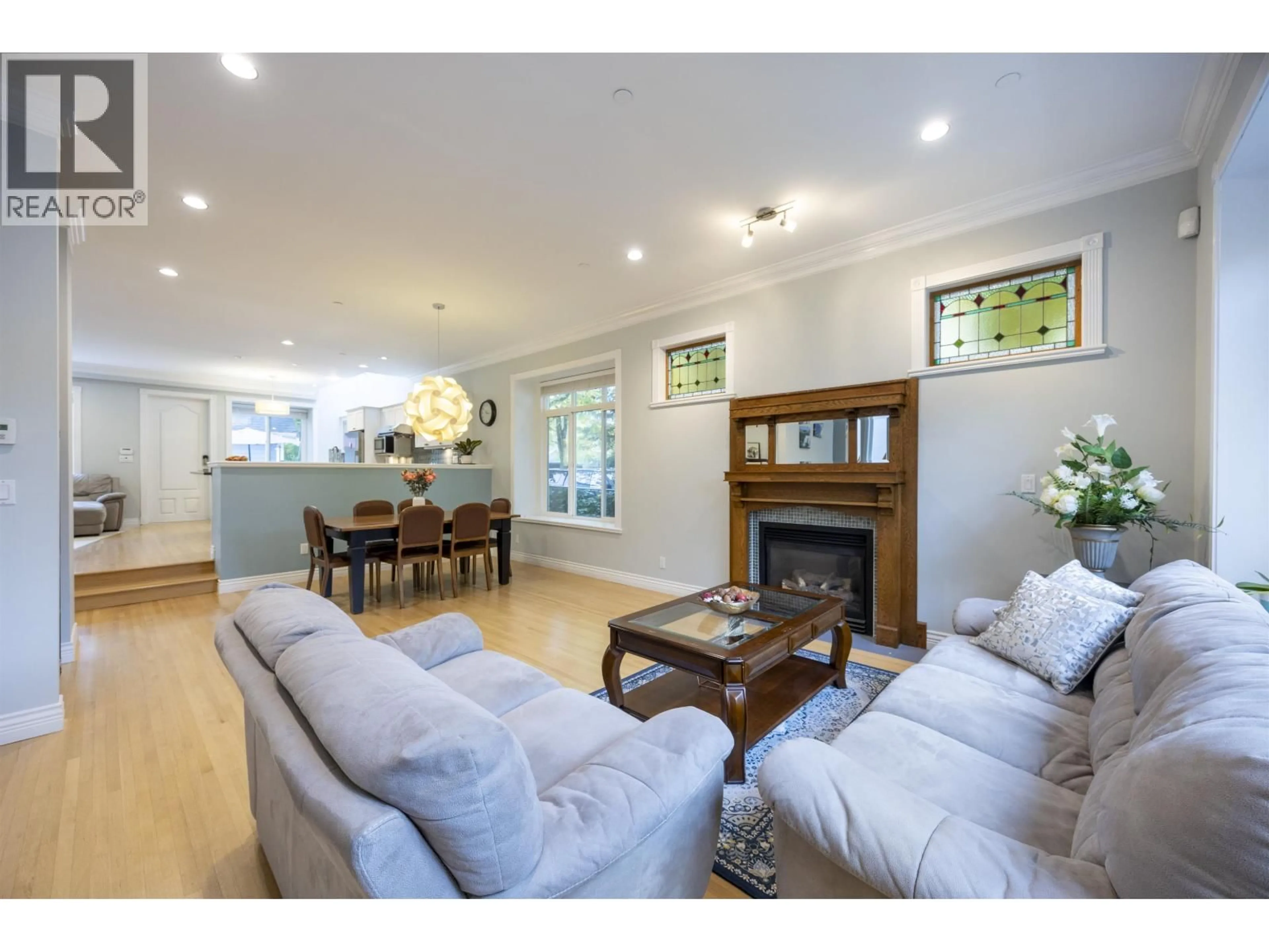 Living room with furniture, wood/laminate floor for 4203 14TH AVENUE, Vancouver British Columbia V6R2X7