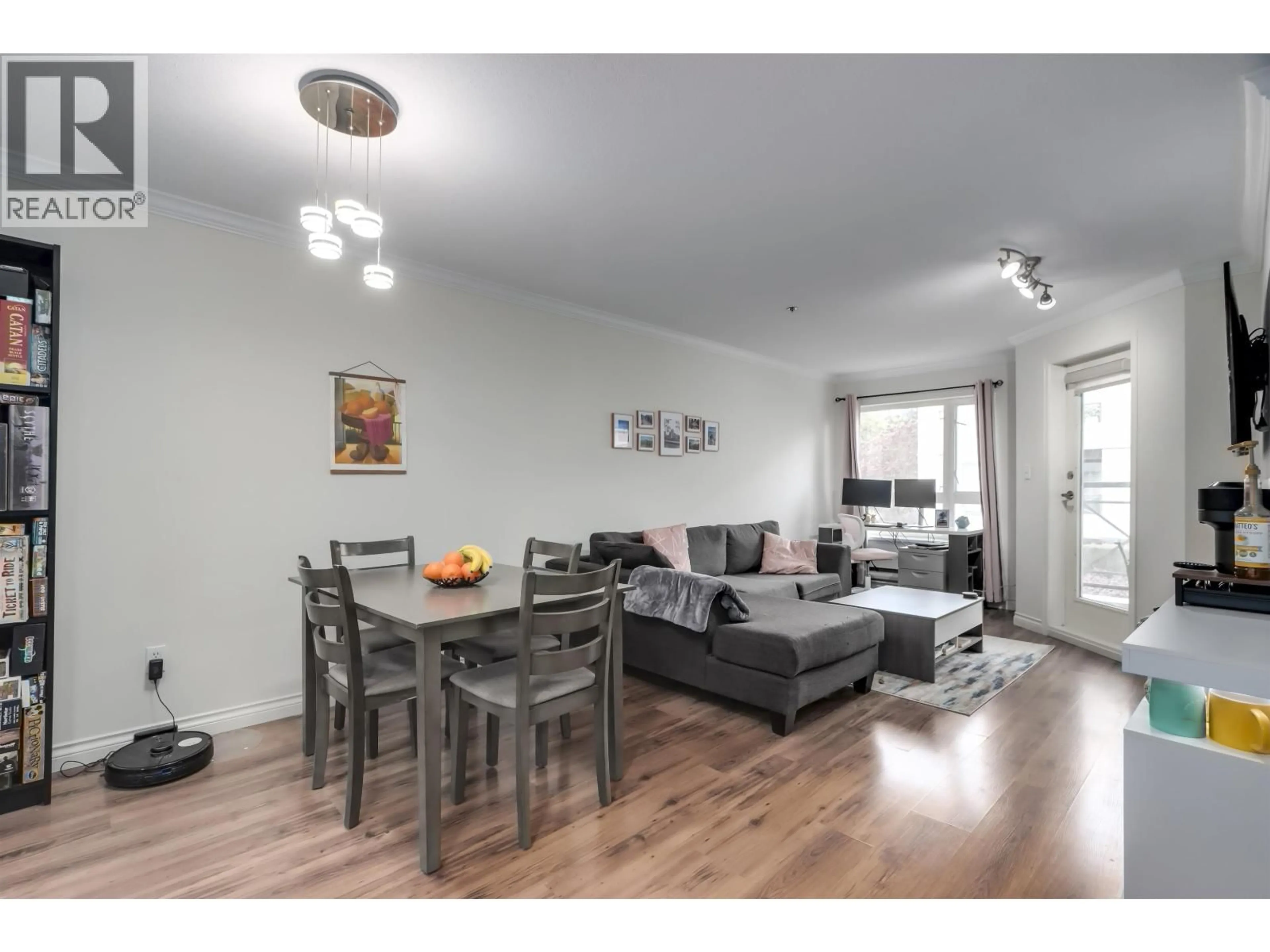 Living room with furniture, wood/laminate floor for 202 - 2335 WHYTE AVENUE, Port Coquitlam British Columbia V3C2A3
