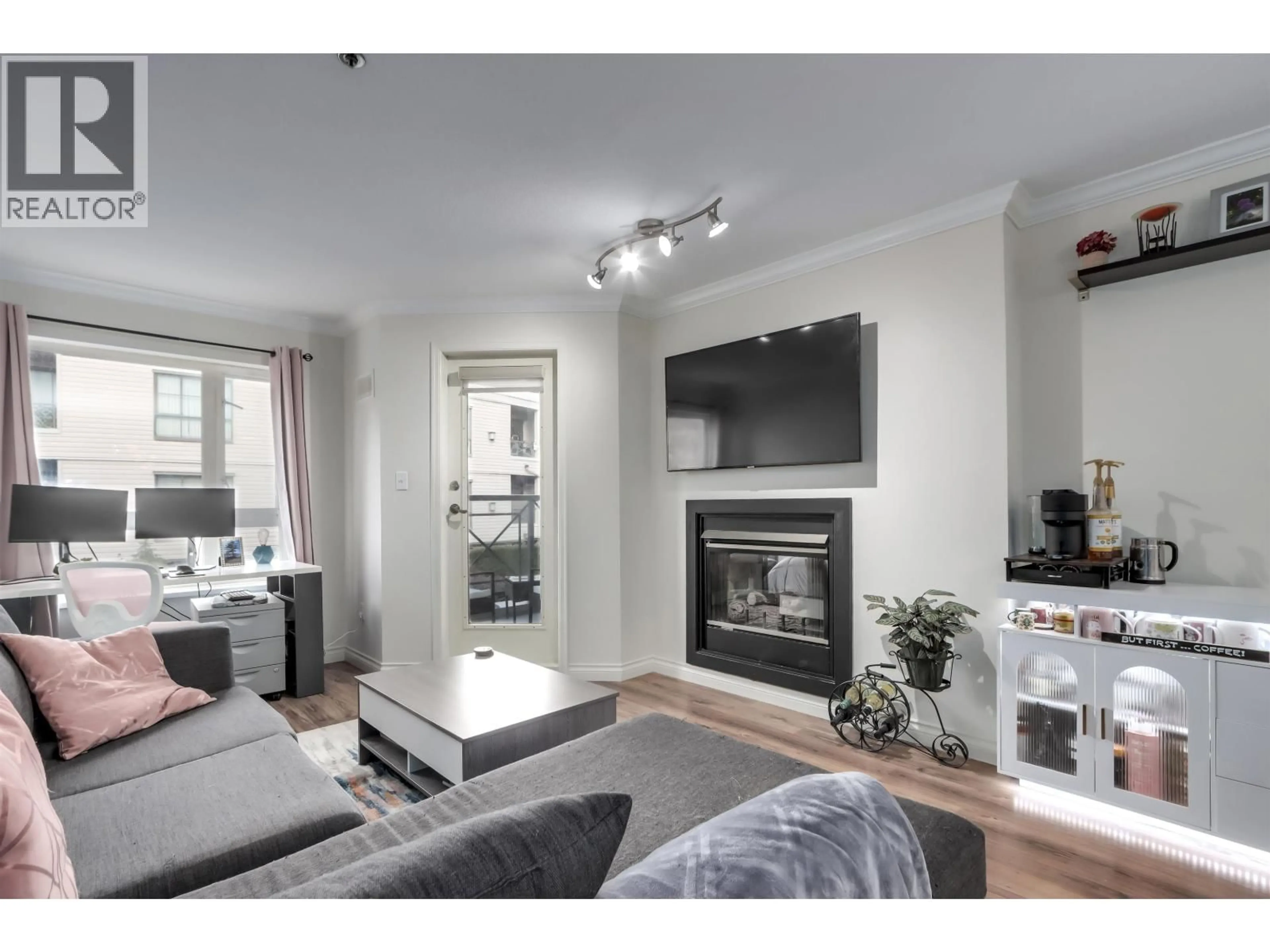 Living room with furniture, wood/laminate floor for 202 - 2335 WHYTE AVENUE, Port Coquitlam British Columbia V3C2A3