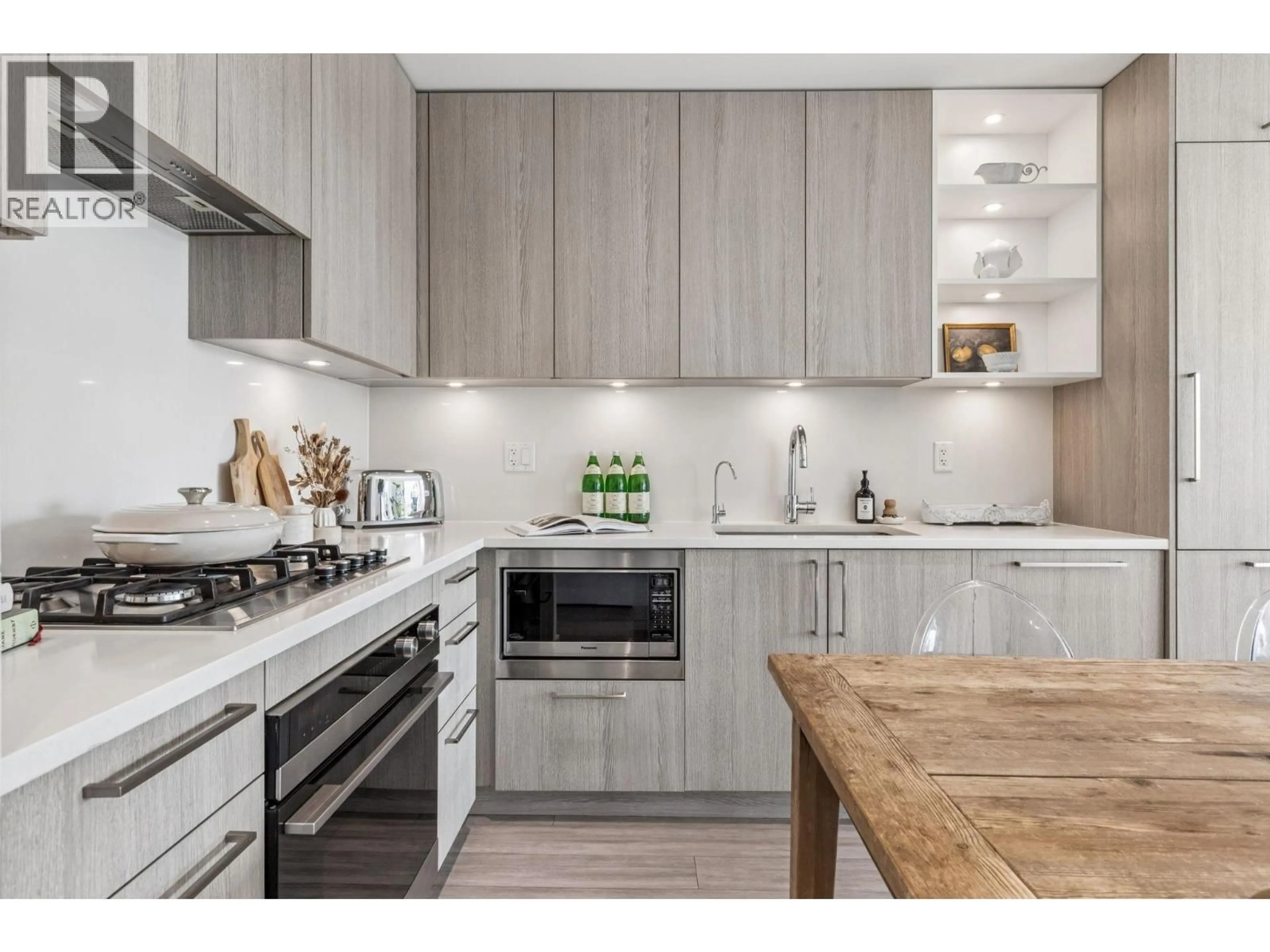Open concept kitchen, wood/laminate floor for 307 - 707 3RD STREET, North Vancouver British Columbia V7L1G8