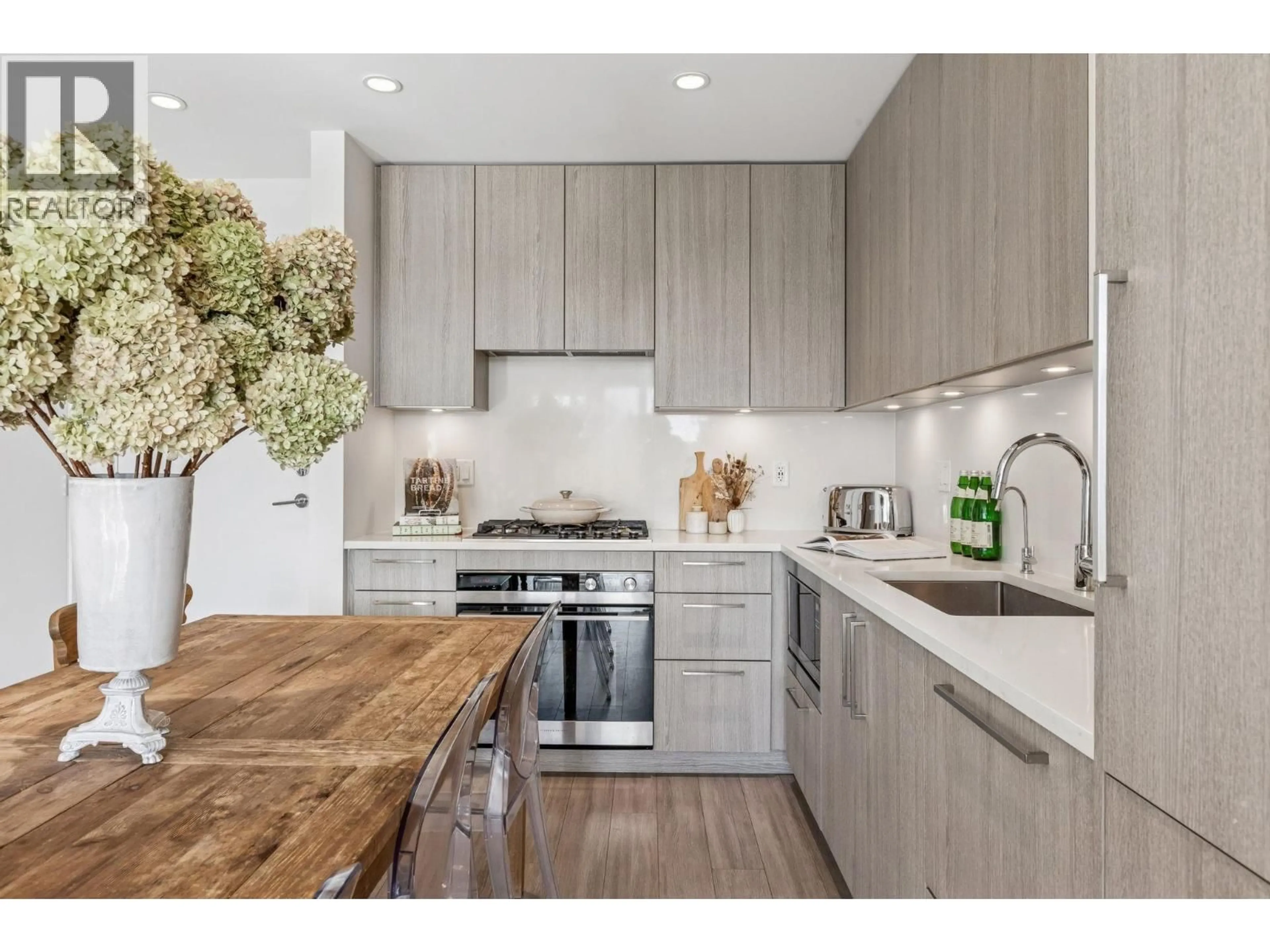 Open concept kitchen, wood/laminate floor for 307 - 707 3RD STREET, North Vancouver British Columbia V7L1G8