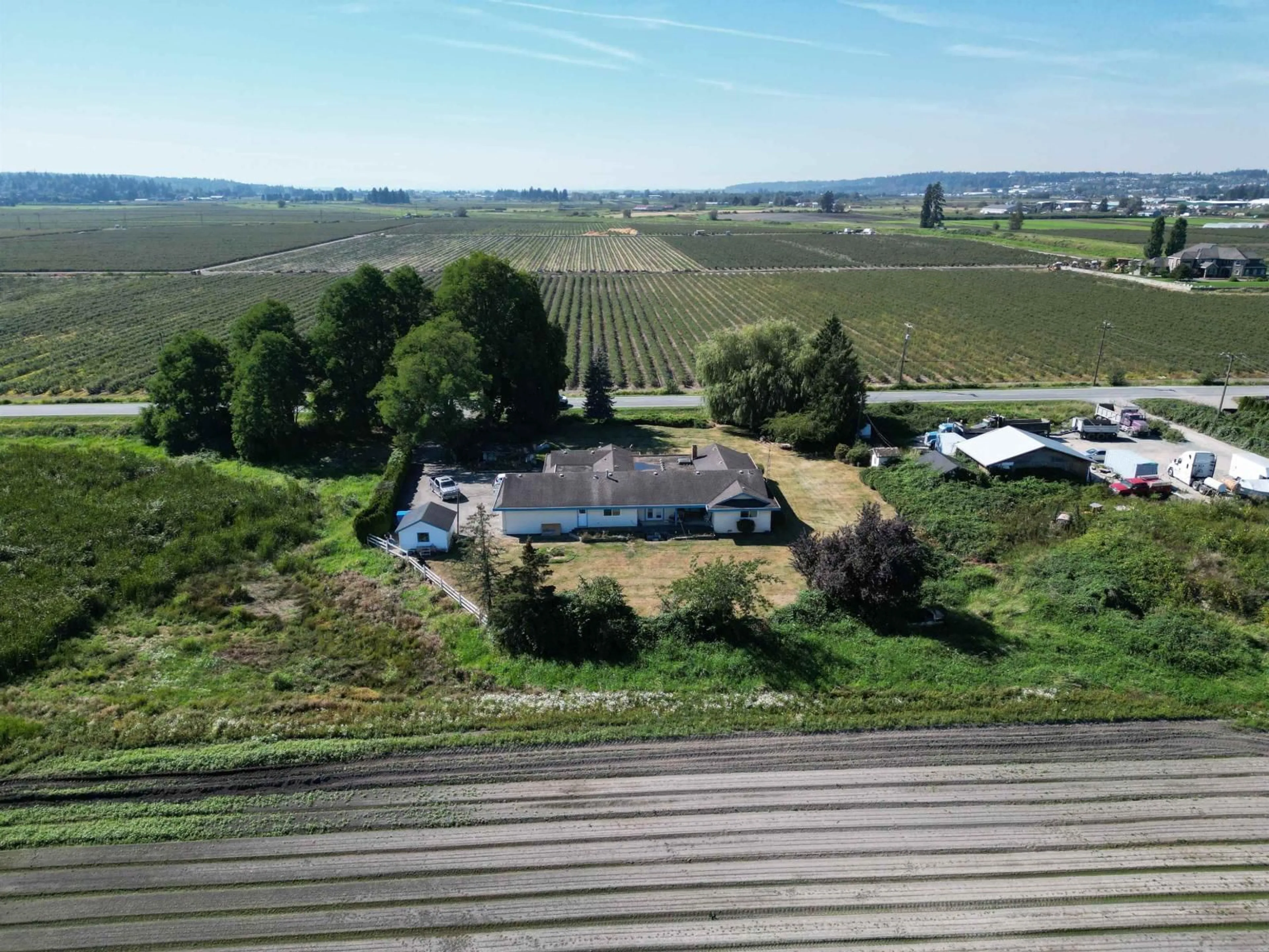 A pic from outside/outdoor area/front of a property/back of a property/a pic from drone, mountain view for 4444 168, Surrey British Columbia V3Z1E3