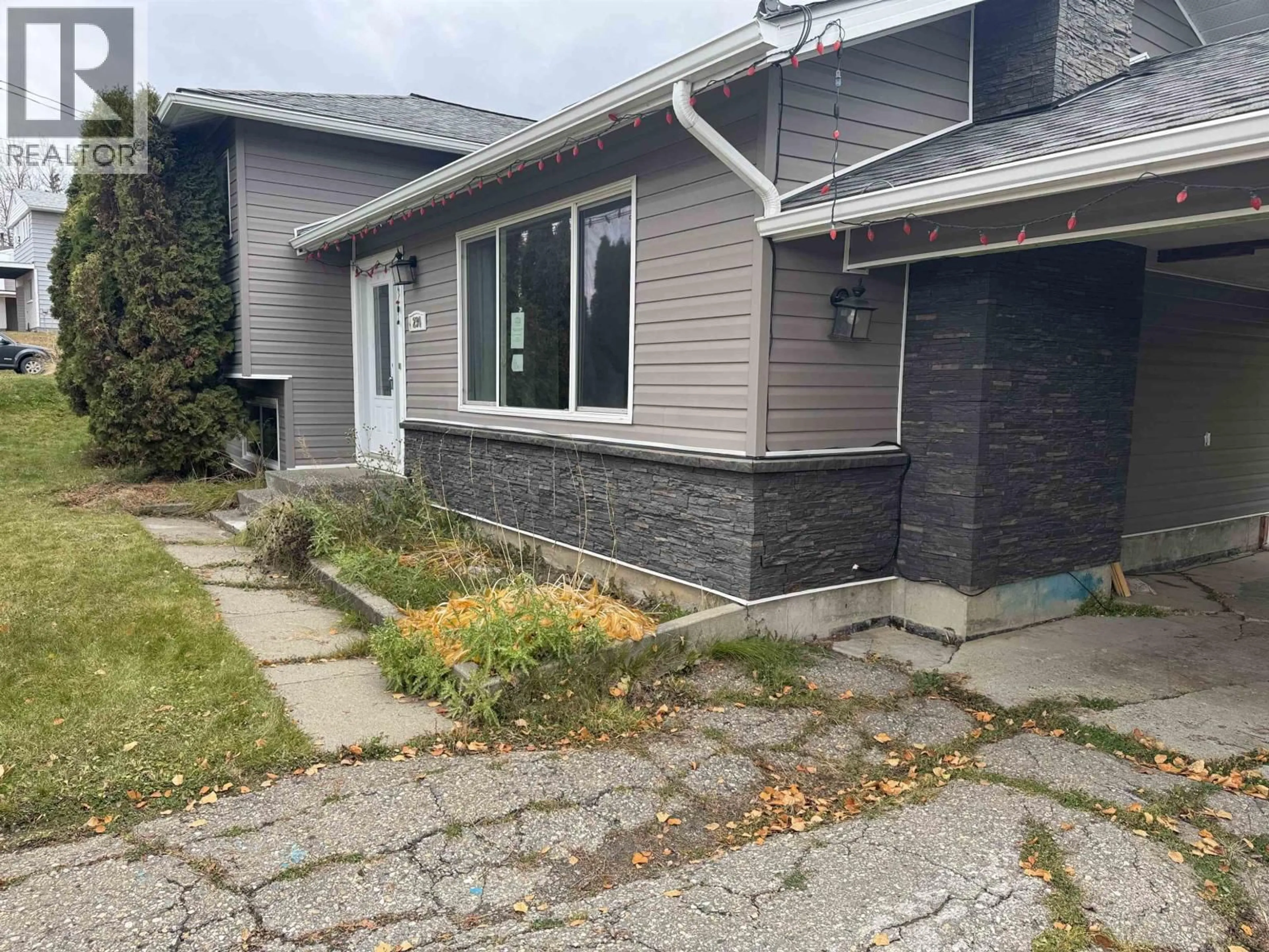 Home with vinyl exterior material, street for 234 CENTENNIAL DRIVE, Mackenzie British Columbia V0J2C0