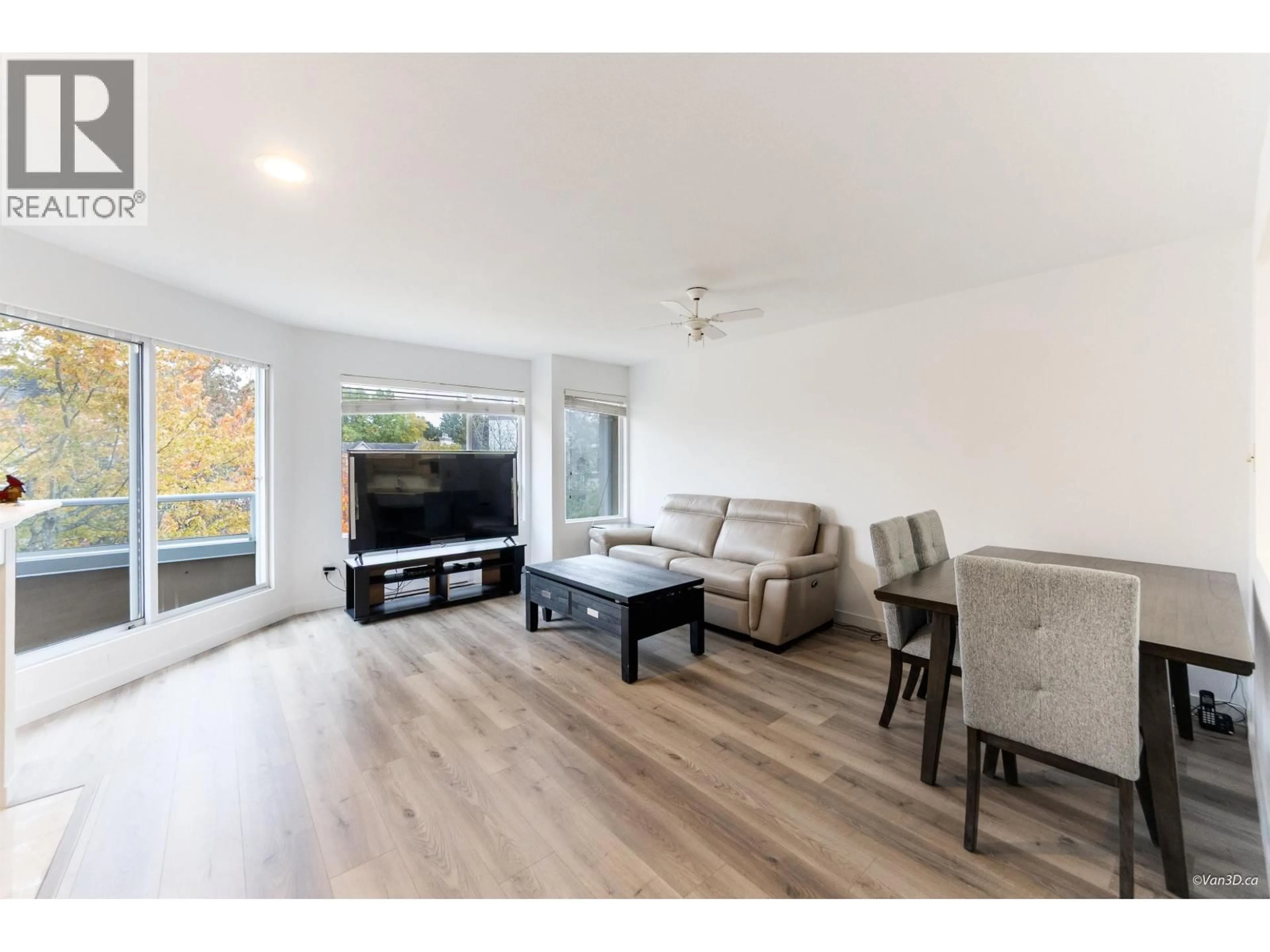 Living room with furniture, wood/laminate floor for 301 - 7480 GILBERT ROAD, Richmond British Columbia V7C3W2