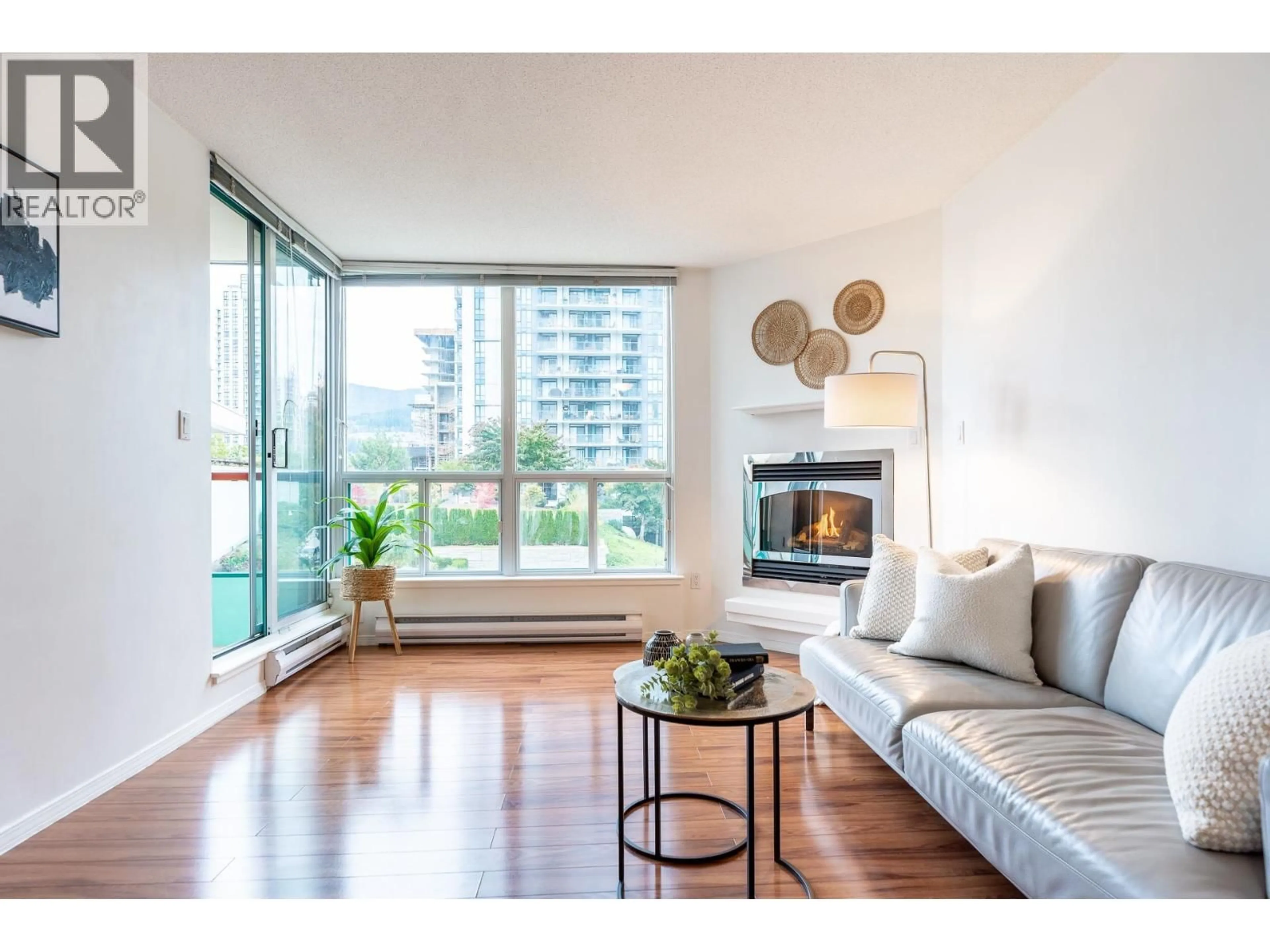 Living room with furniture, wood/laminate floor for 405 - 1148 HEFFLEY CRESCENT, Coquitlam British Columbia V3B8A6