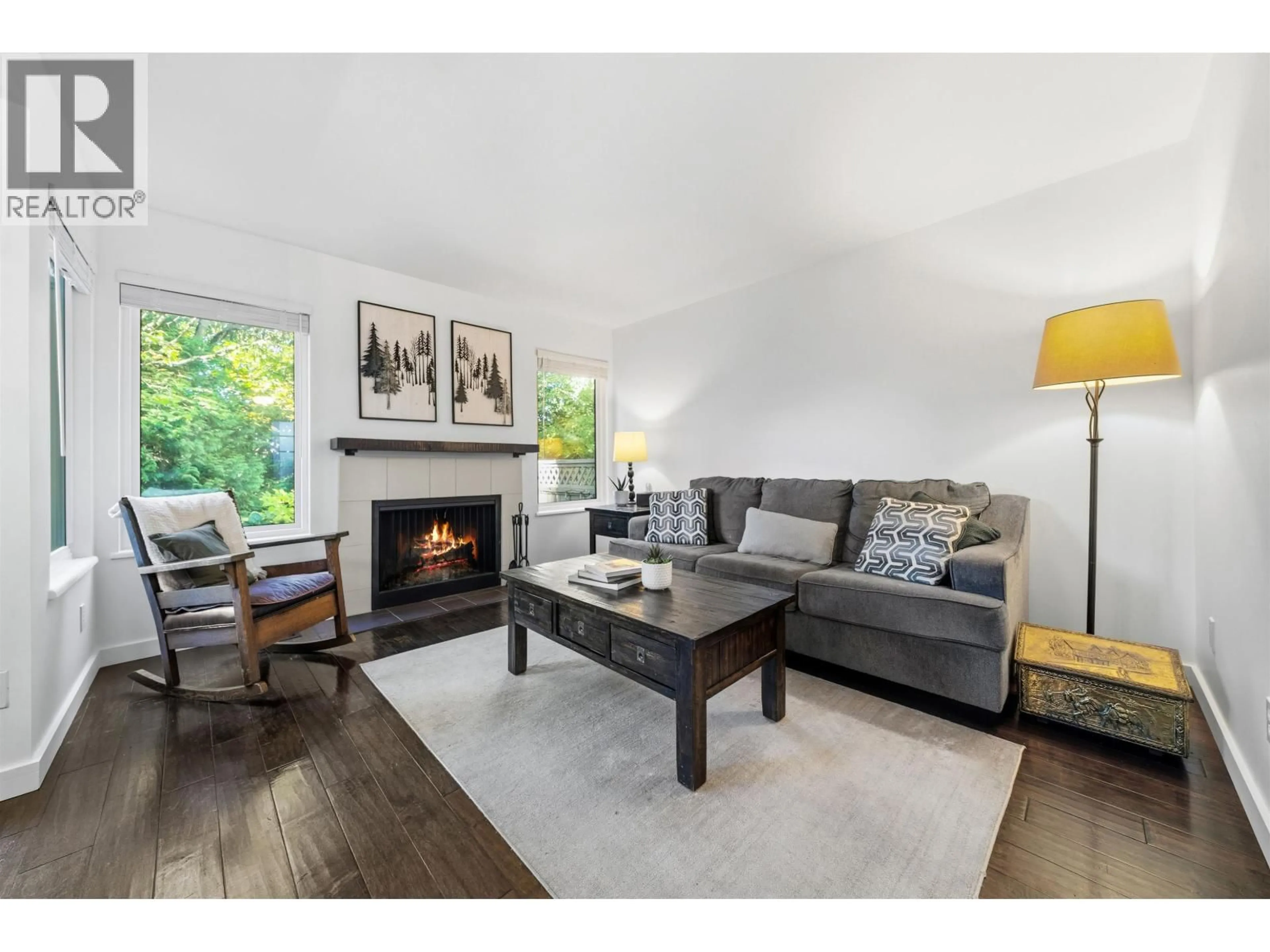 Living room with furniture, wood/laminate floor for 4742 LAURELWOOD PLACE, Burnaby British Columbia V5G4B2