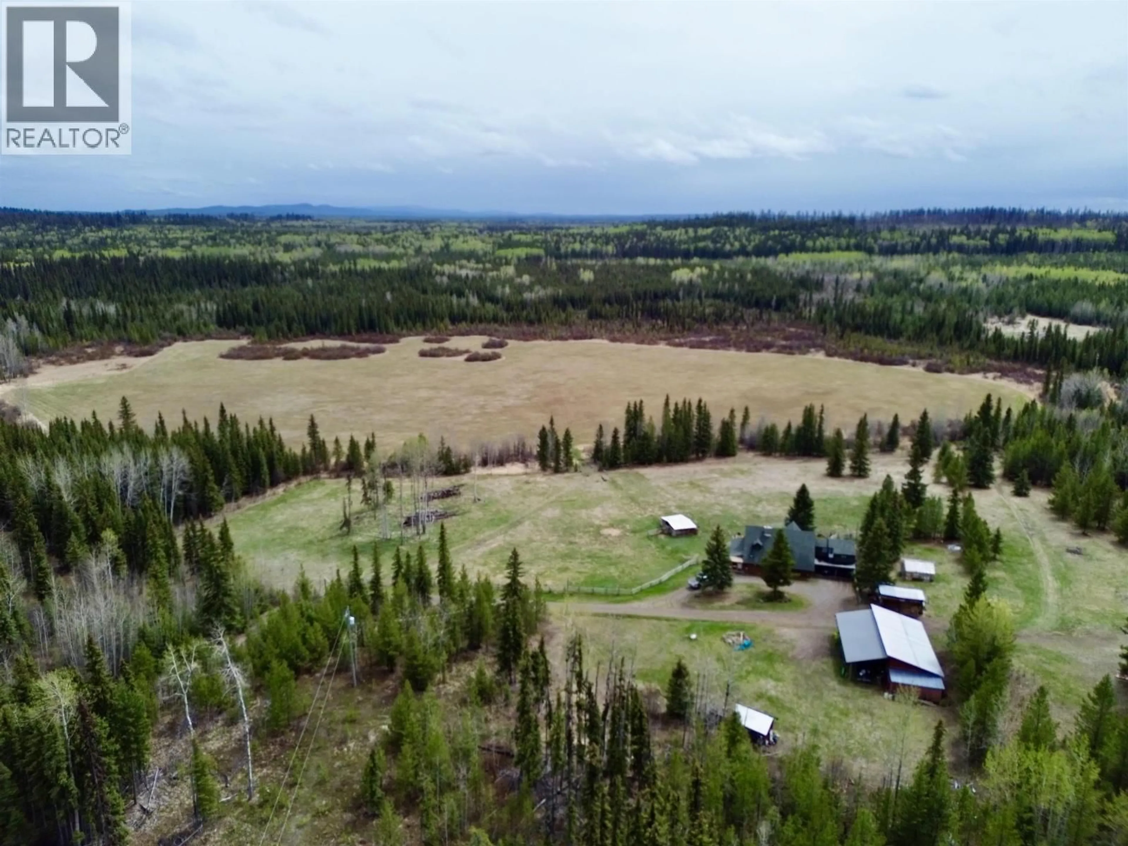 A pic from outside/outdoor area/front of a property/back of a property/a pic from drone, forest/trees view for 4050 SPOKIN LAKE ROAD, 150 Mile House British Columbia V0K2G0