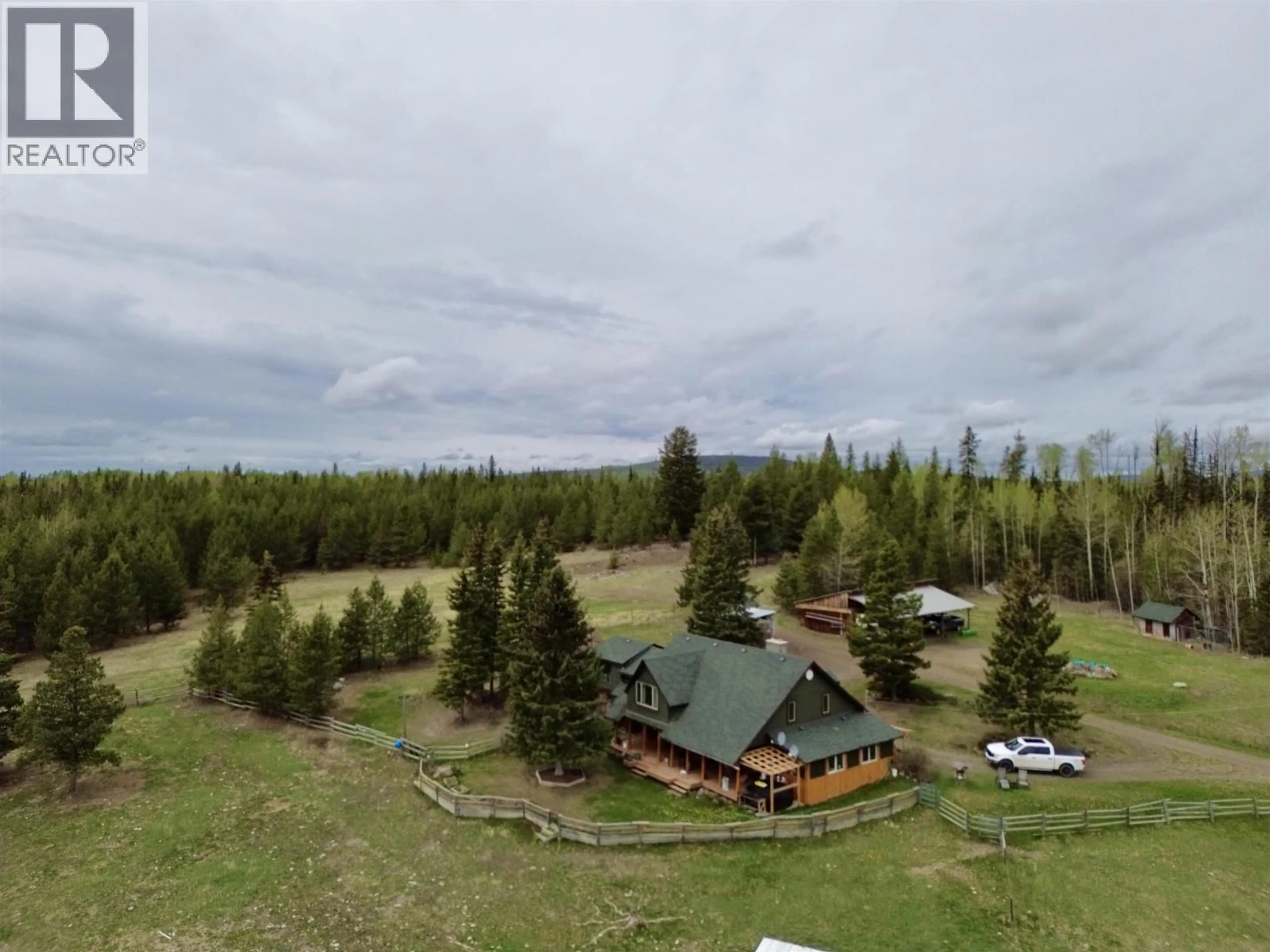 A pic from outside/outdoor area/front of a property/back of a property/a pic from drone, forest/trees view for 4050 SPOKIN LAKE ROAD, 150 Mile House British Columbia V0K2G0