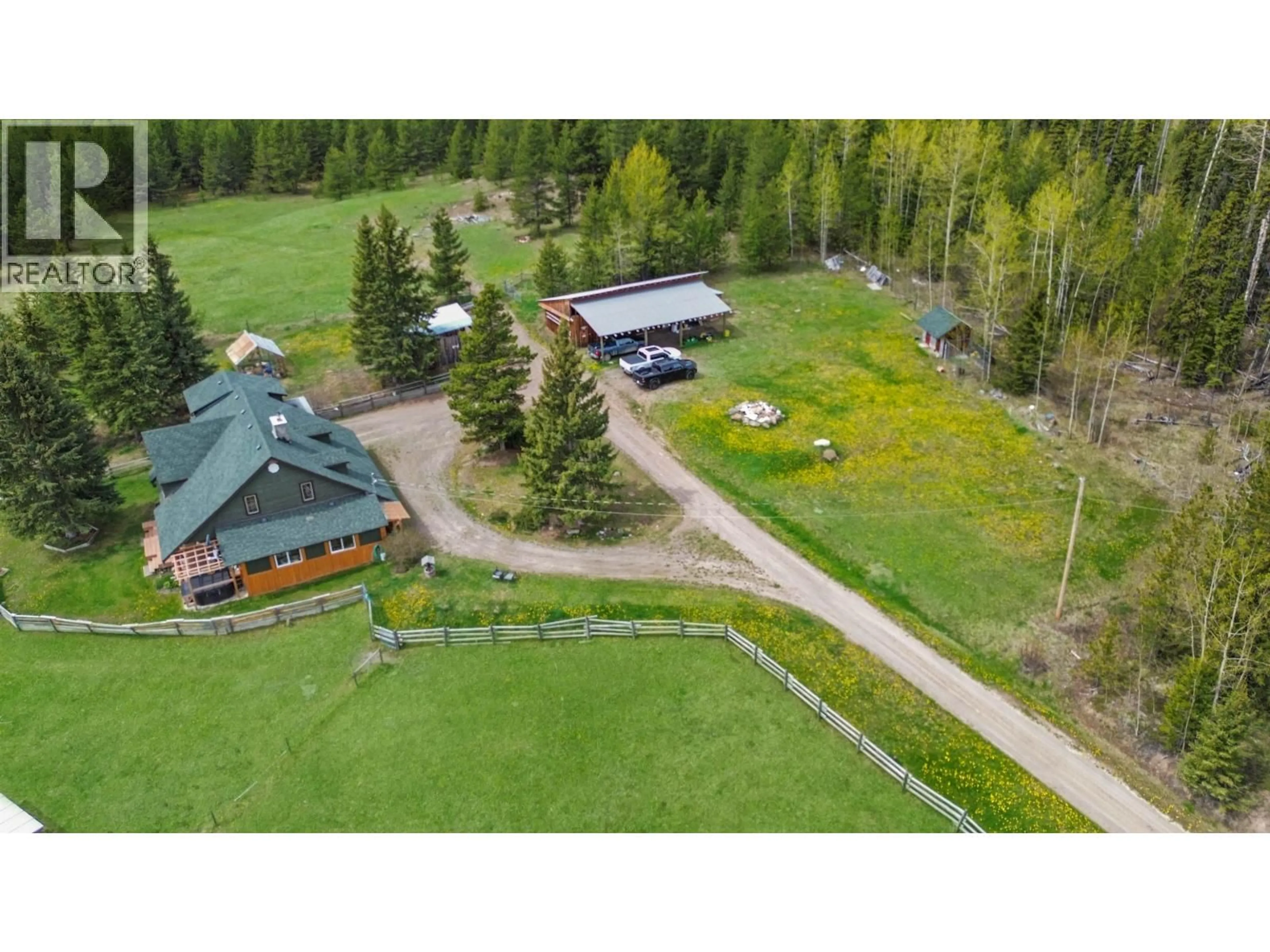A pic from outside/outdoor area/front of a property/back of a property/a pic from drone, mountain view for 4050 SPOKIN LAKE ROAD, 150 Mile House British Columbia V0K2G0