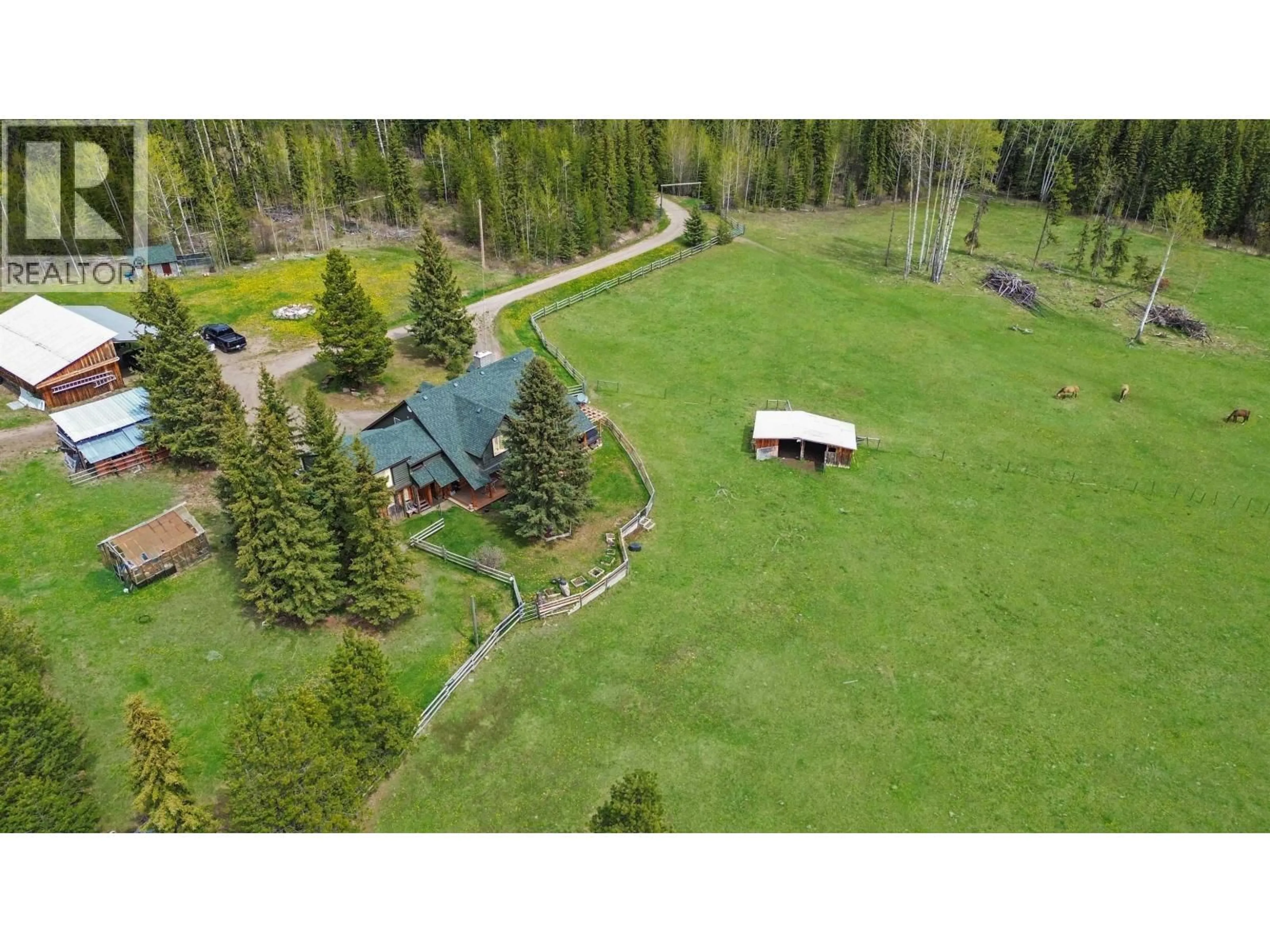 A pic from outside/outdoor area/front of a property/back of a property/a pic from drone, unknown for 4050 SPOKIN LAKE ROAD, 150 Mile House British Columbia V0K2G0
