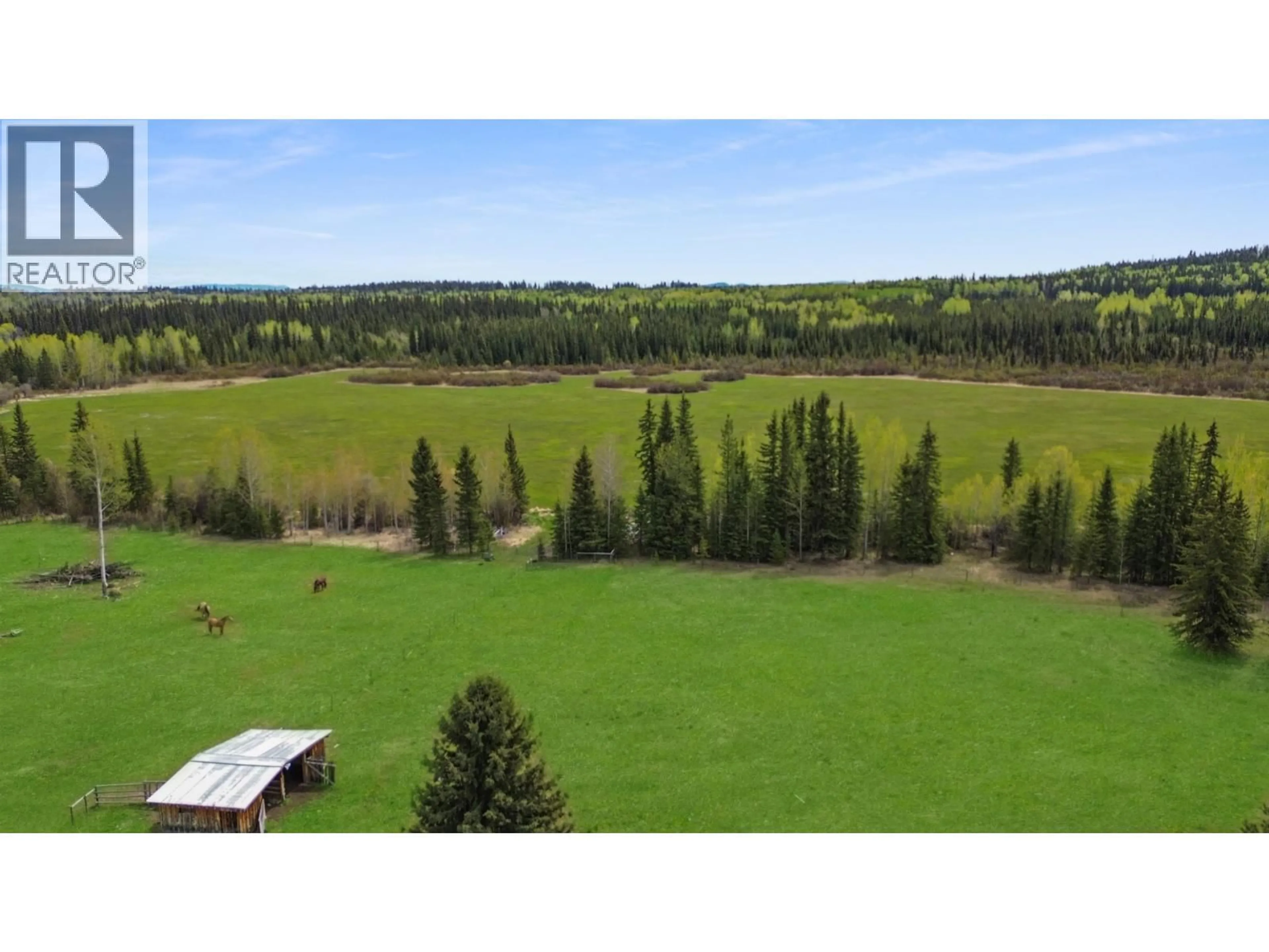 A pic from outside/outdoor area/front of a property/back of a property/a pic from drone, forest/trees view for 4050 SPOKIN LAKE ROAD, 150 Mile House British Columbia V0K2G0