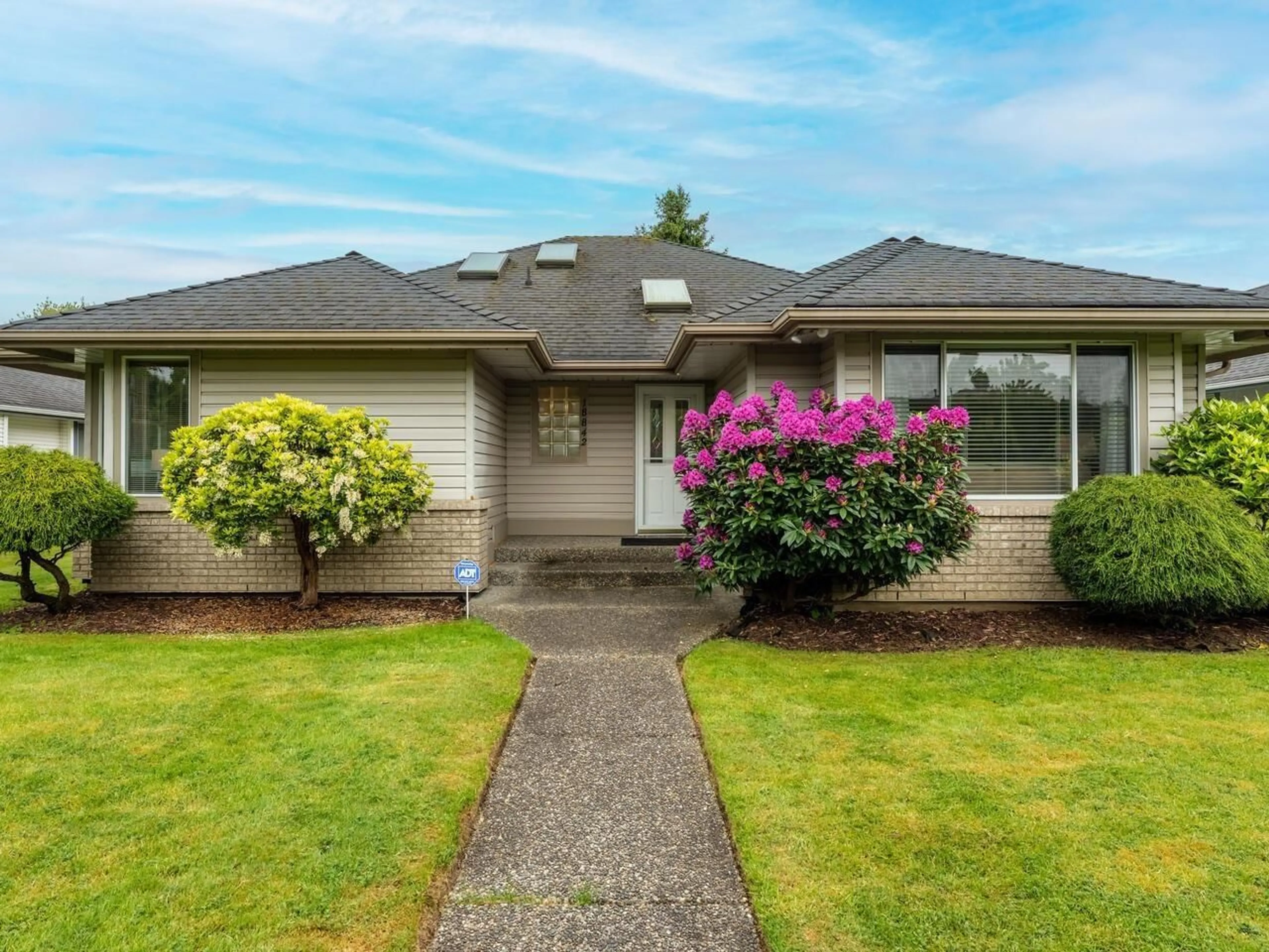 Home with vinyl exterior material, street for 18842 64, Surrey British Columbia V3S7T9