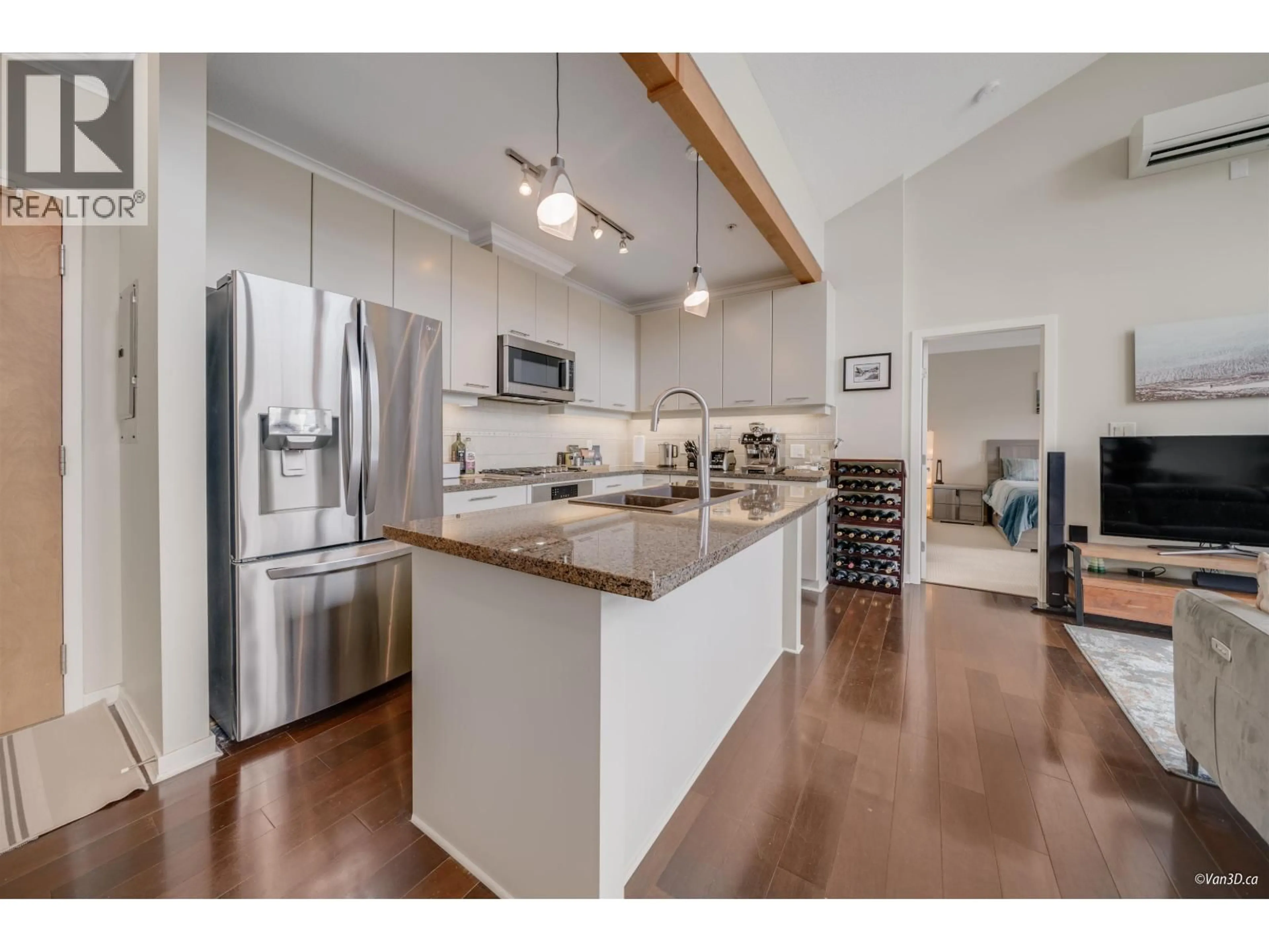 Open concept kitchen, wood/laminate floor for 506 - 530 RAVEN WOODS DRIVE, North Vancouver British Columbia V7G2T5