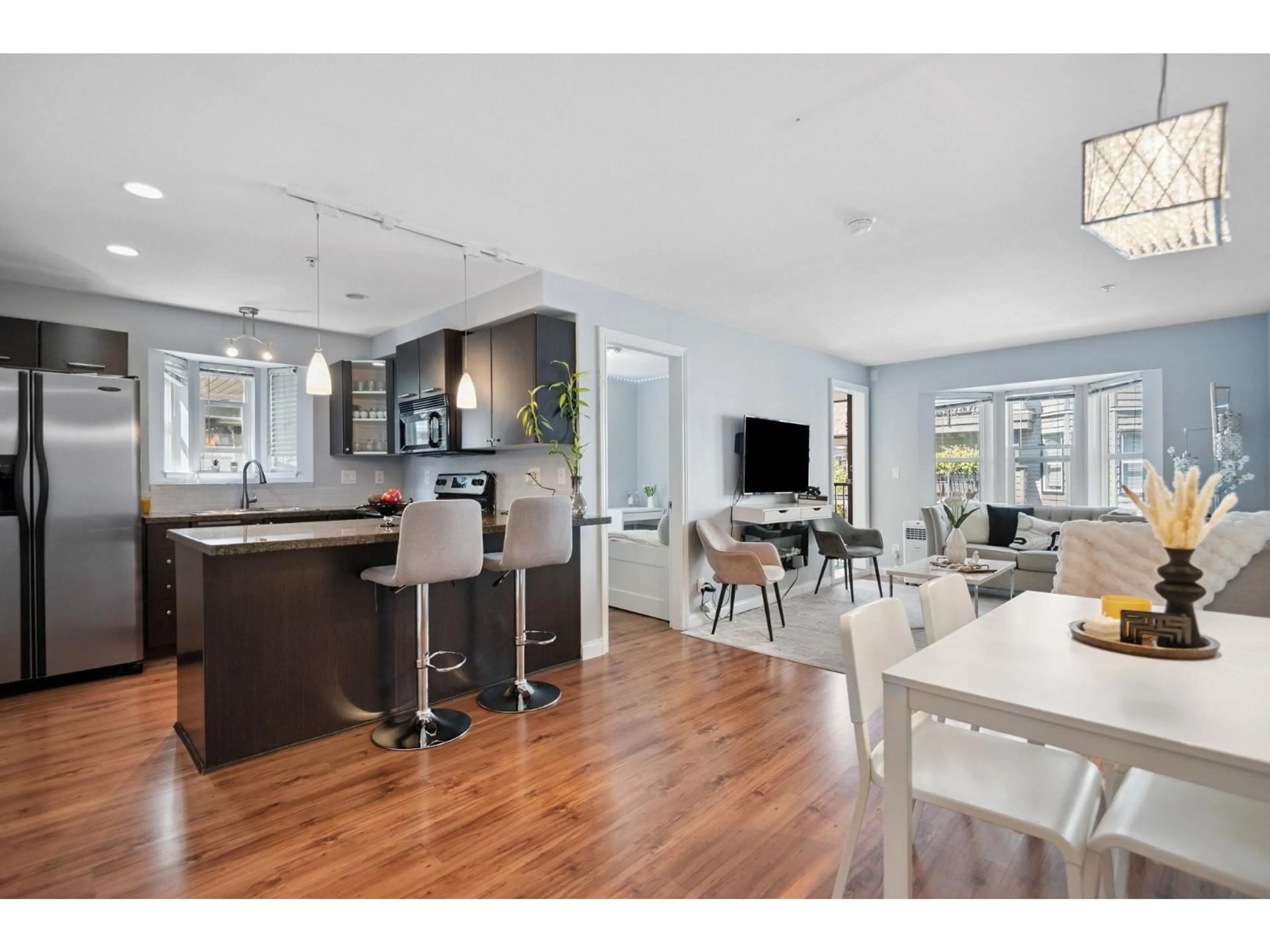 Open concept kitchen, wood/laminate floor for 211 - 5454 198, Langley British Columbia V3A1G2
