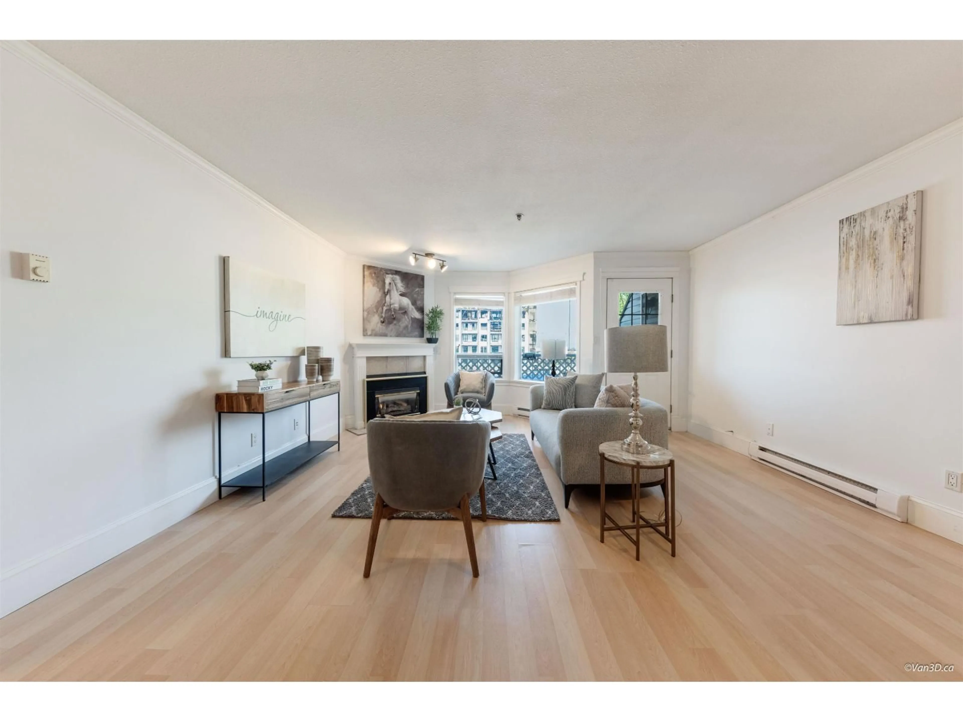 Living room with furniture, wood/laminate floor for 305 - 5710 201, Langley British Columbia V3A8A8